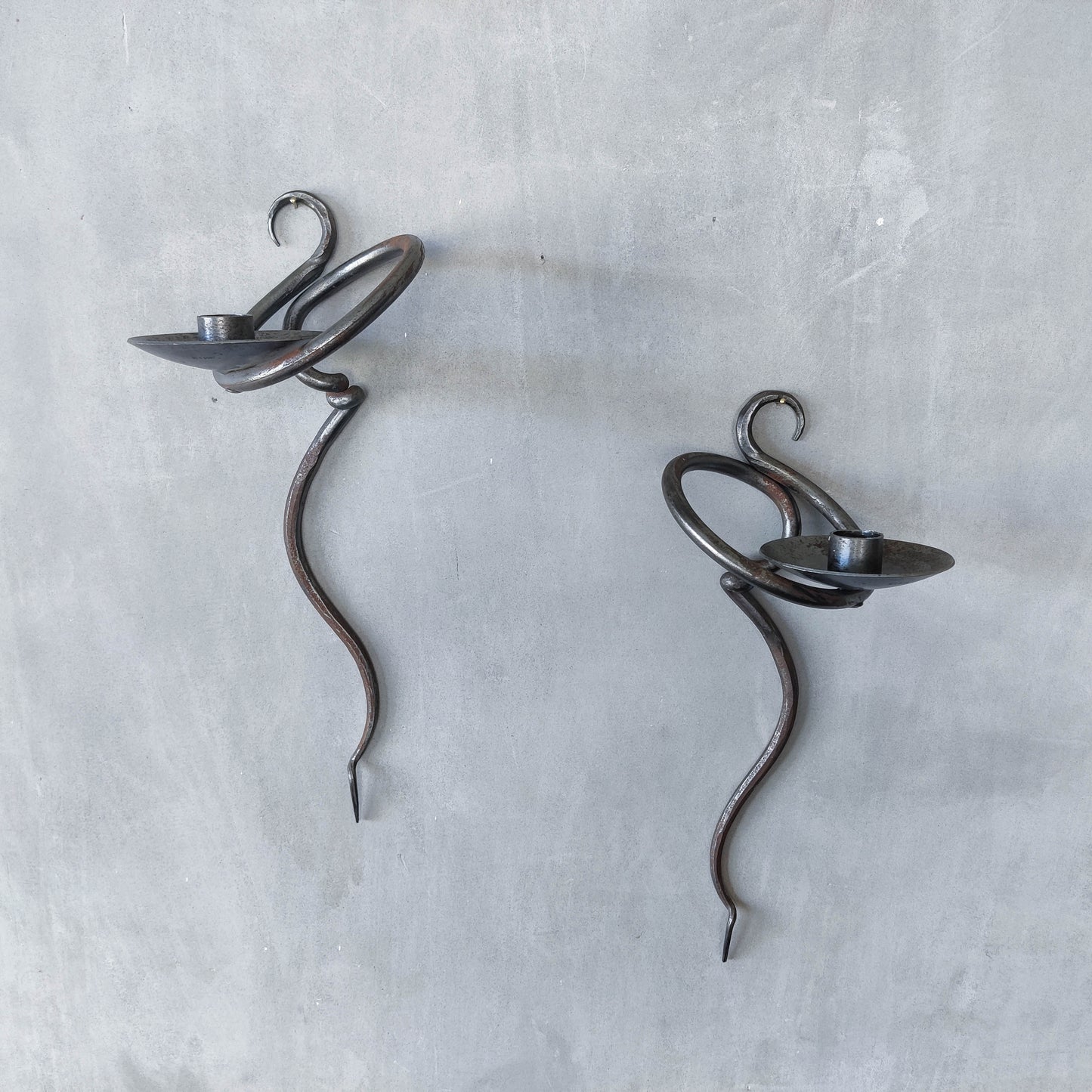 Pair of vintage hand forged blacksmith made hammered twisted steel candle sconces