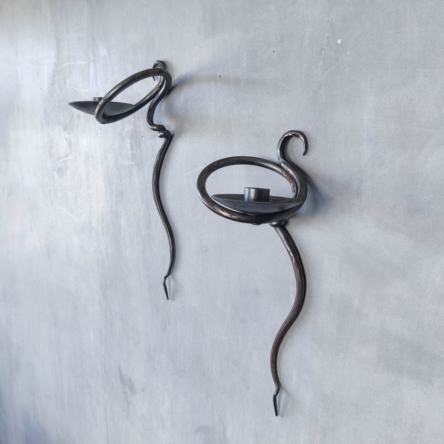 Pair of vintage hand forged blacksmith made hammered twisted steel candle sconces