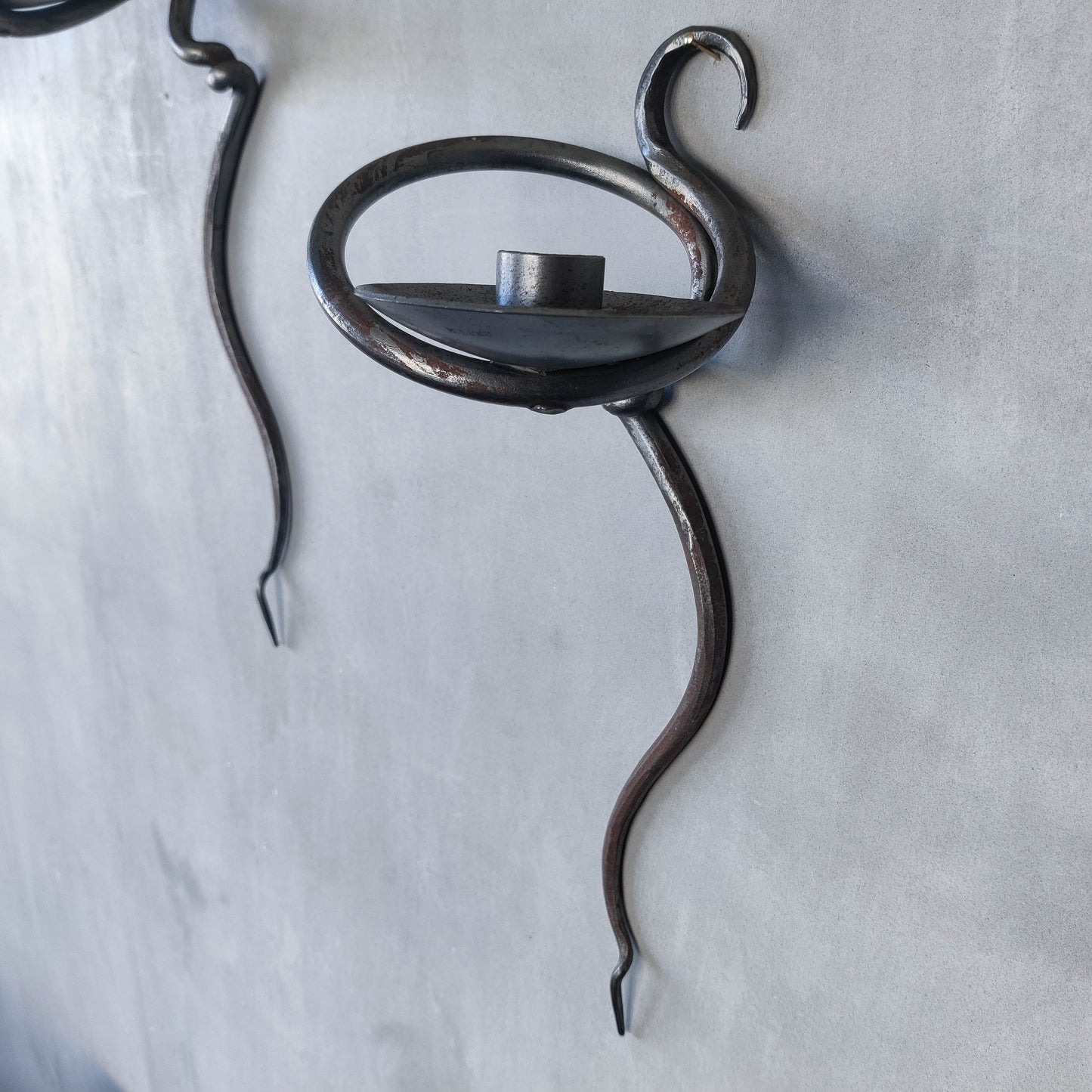 Pair of vintage hand forged blacksmith made hammered twisted steel candle sconces
