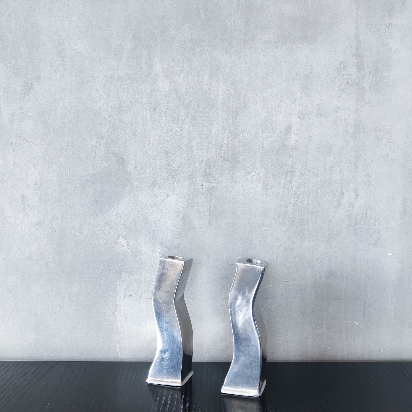 Pair of vintage cast aluminium 1990s modernist wavy wiggle sculptural candle holders