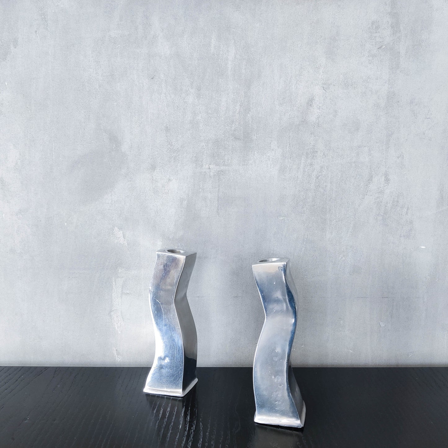 Pair of vintage cast aluminium 1990s modernist wavy wiggle sculptural candle holders