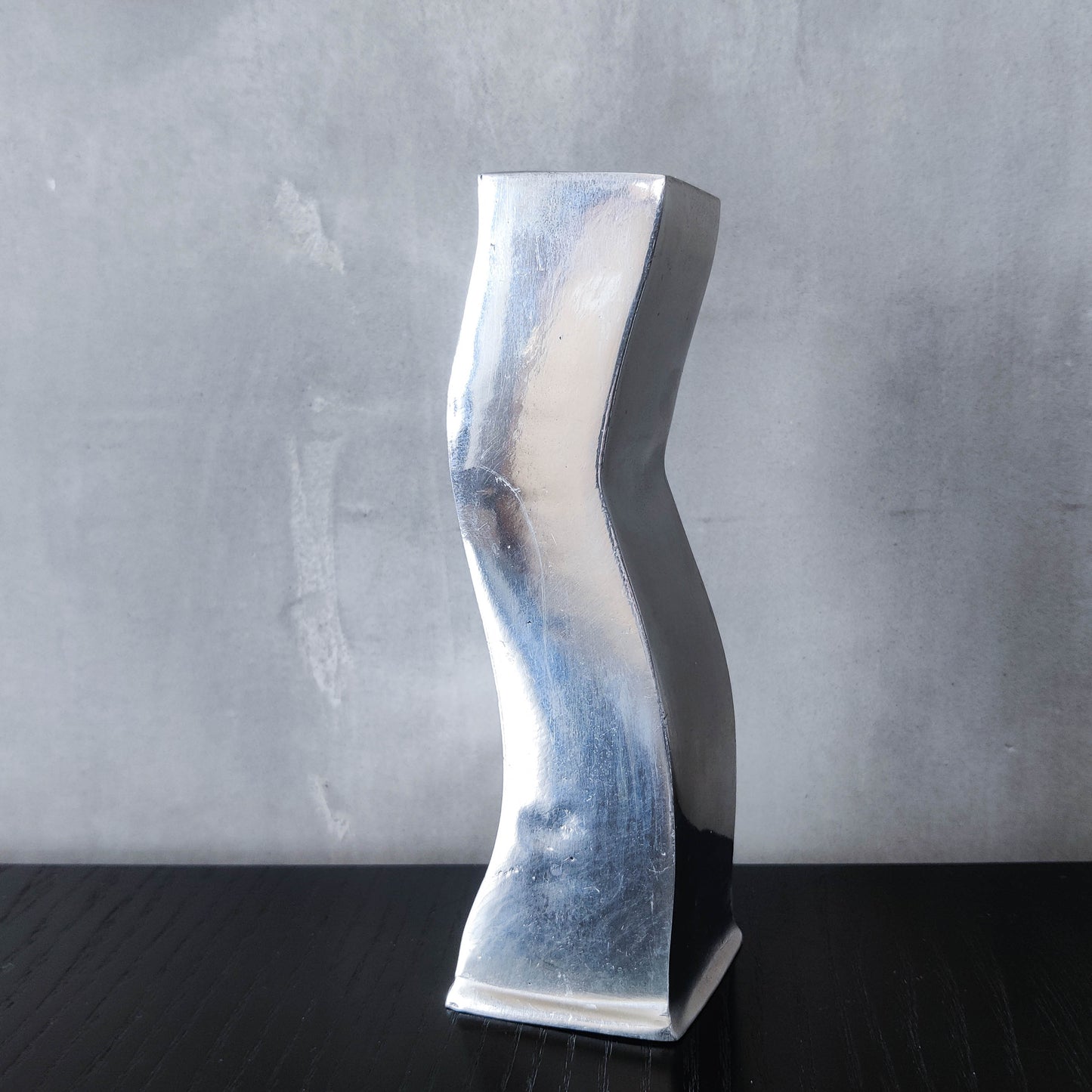 Pair of vintage cast aluminium 1990s modernist wavy wiggle sculptural candle holders