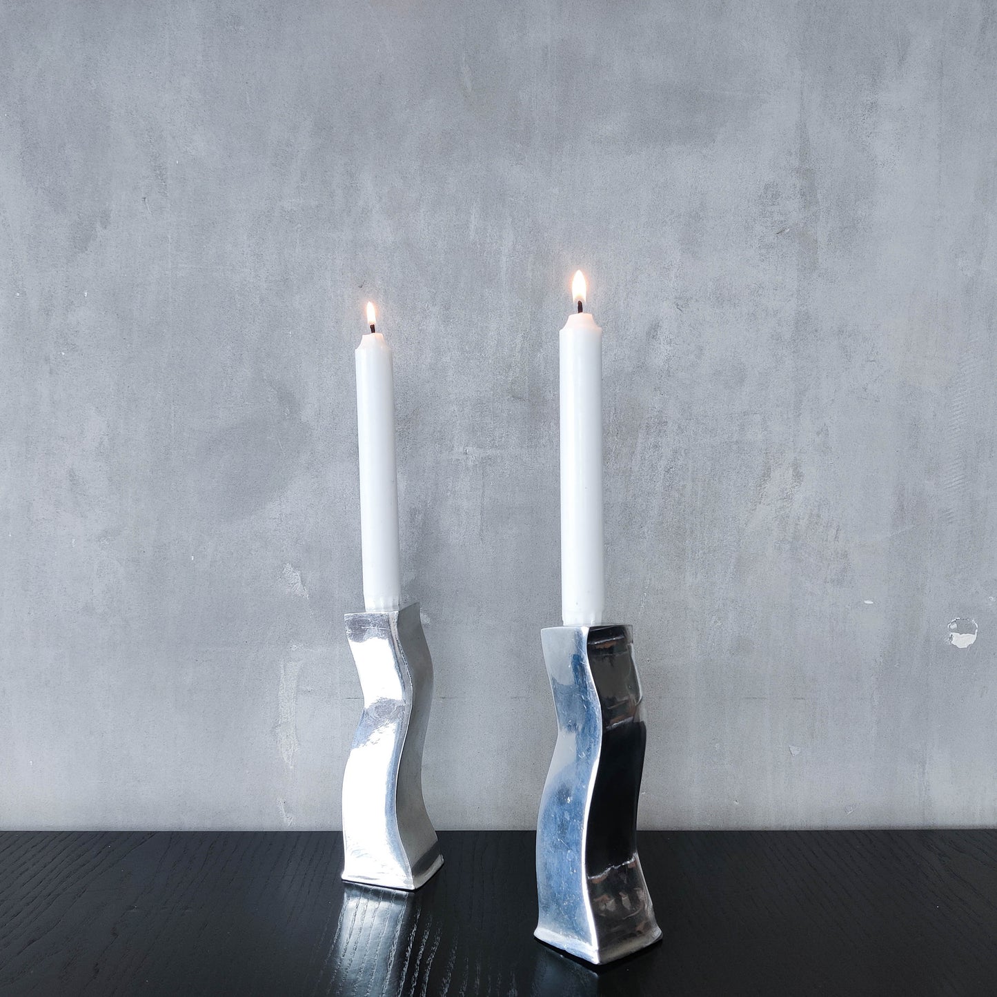Pair of vintage cast aluminium 1990s modernist wavy wiggle sculptural candle holders
