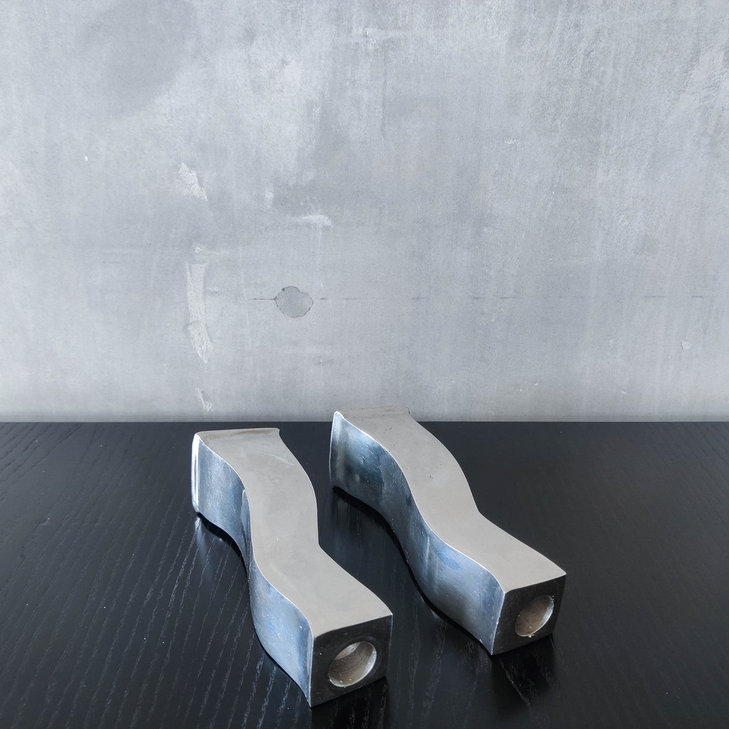 Pair of vintage cast aluminium 1990s modernist wavy wiggle sculptural candle holders