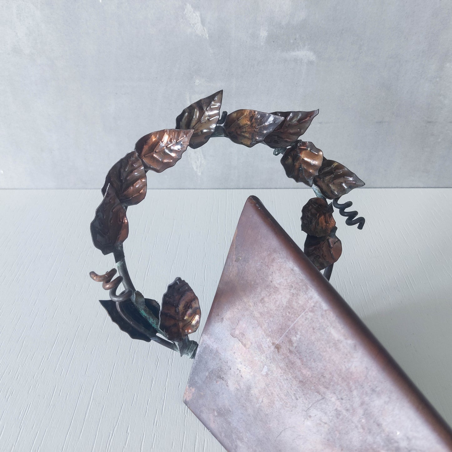 Artisan fabricated copper sculptural pyramid metalwork candle sconce leaf wreath