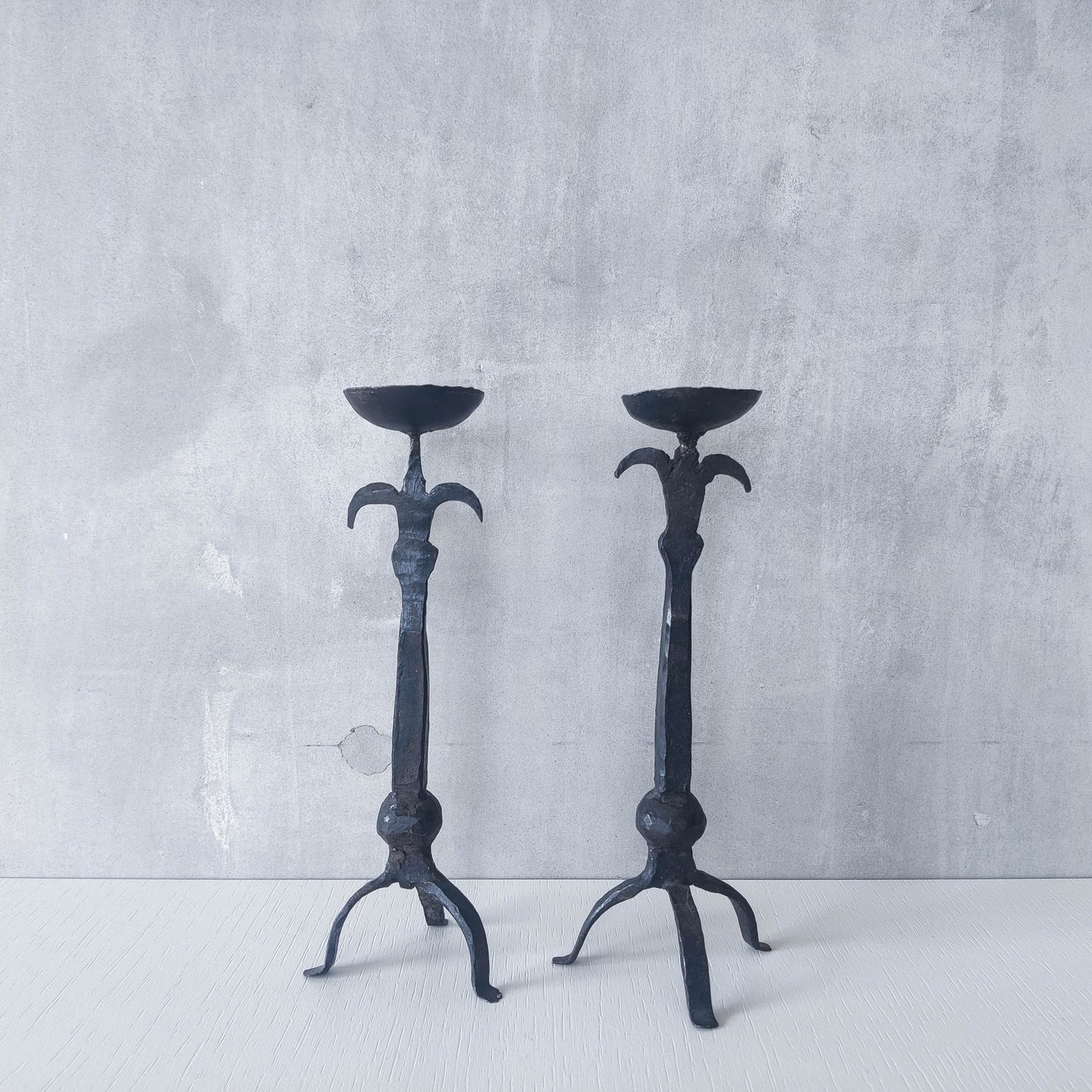 Pair of vintage hand forged wrought iron blacksmith made candle holders crude style