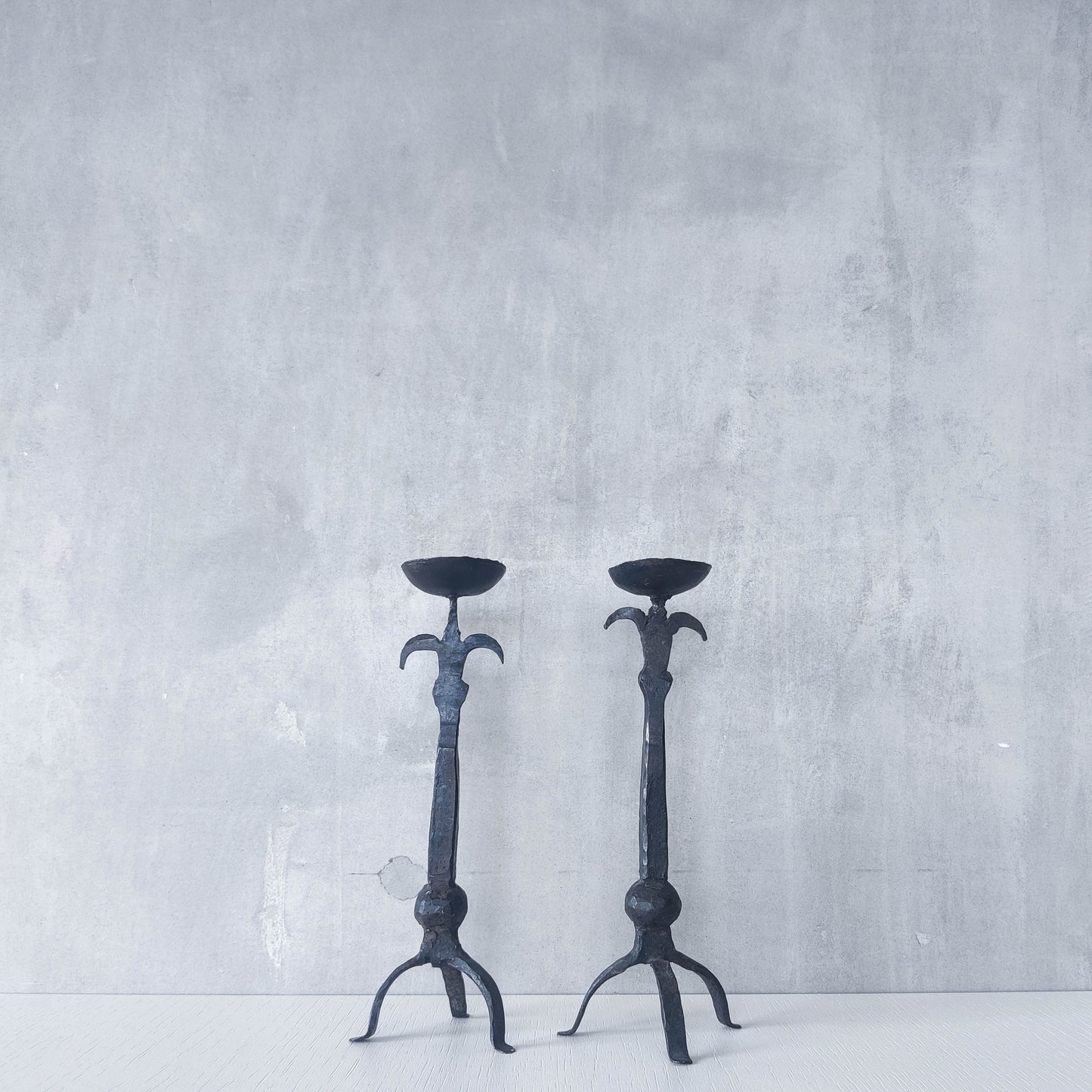 Pair of vintage hand forged wrought iron blacksmith made candle holders crude style