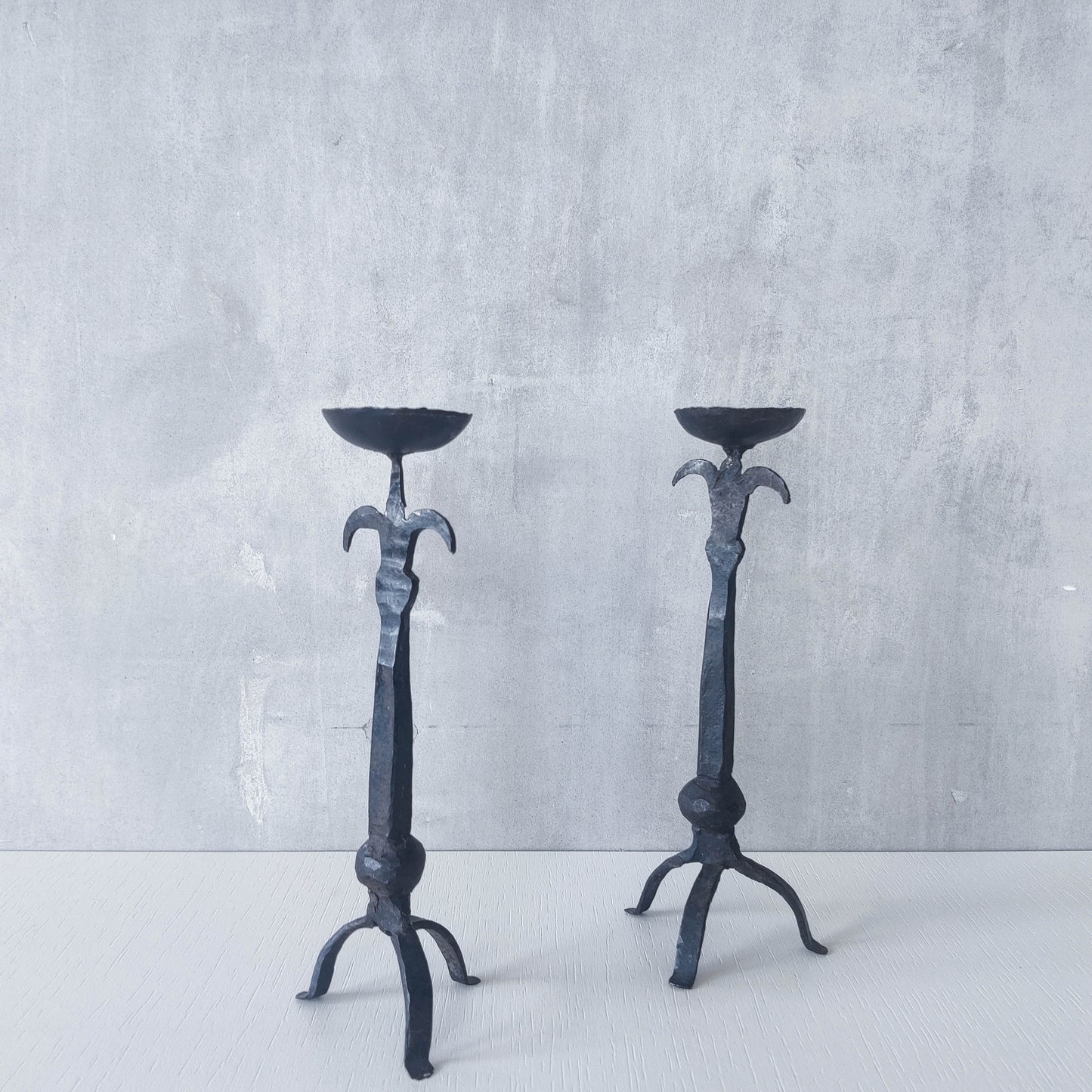 Pair of vintage hand forged wrought iron blacksmith made candle holders crude style