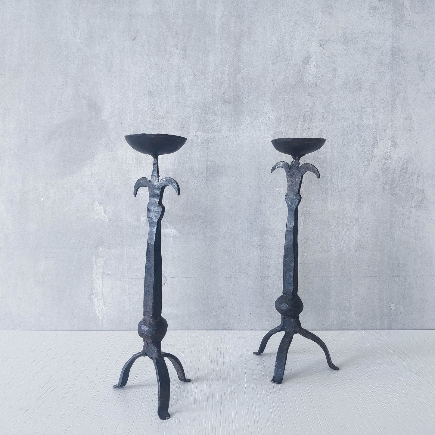 Pair of vintage hand forged wrought iron blacksmith made candle holders crude style