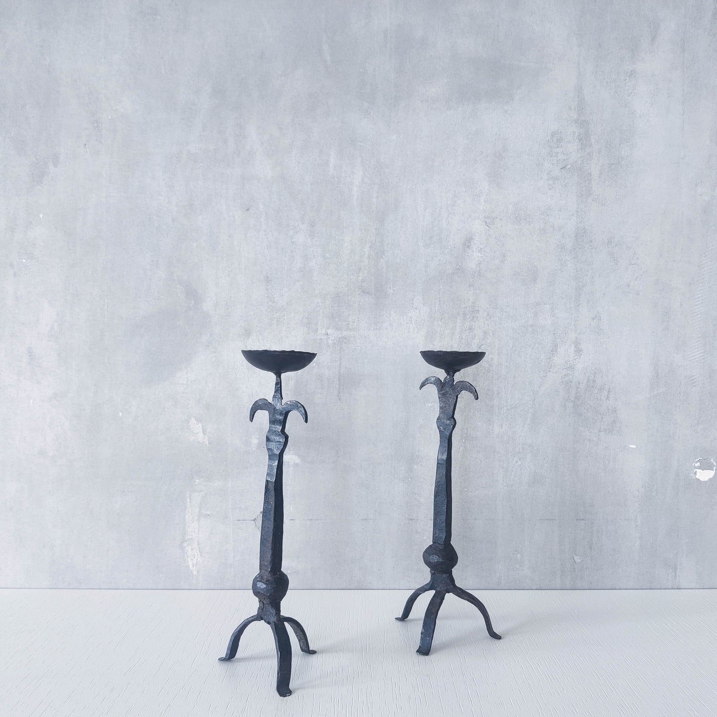 Pair of vintage hand forged wrought iron blacksmith made candle holders crude style