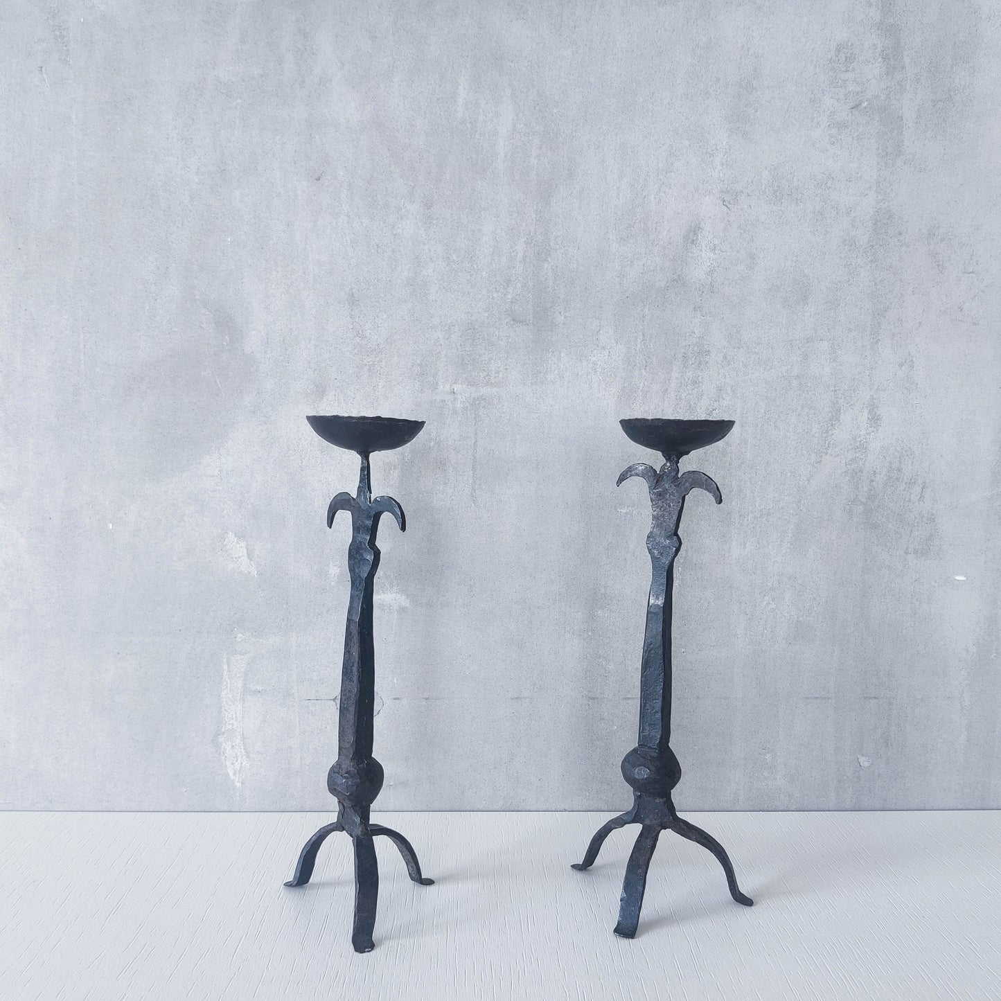 Pair of vintage hand forged wrought iron blacksmith made candle holders crude style