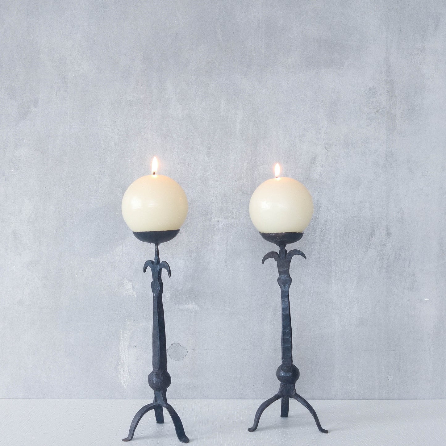 Pair of vintage hand forged wrought iron blacksmith made candle holders crude style