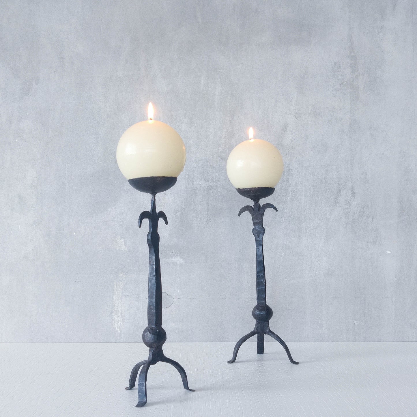 Pair of vintage hand forged wrought iron blacksmith made candle holders crude style