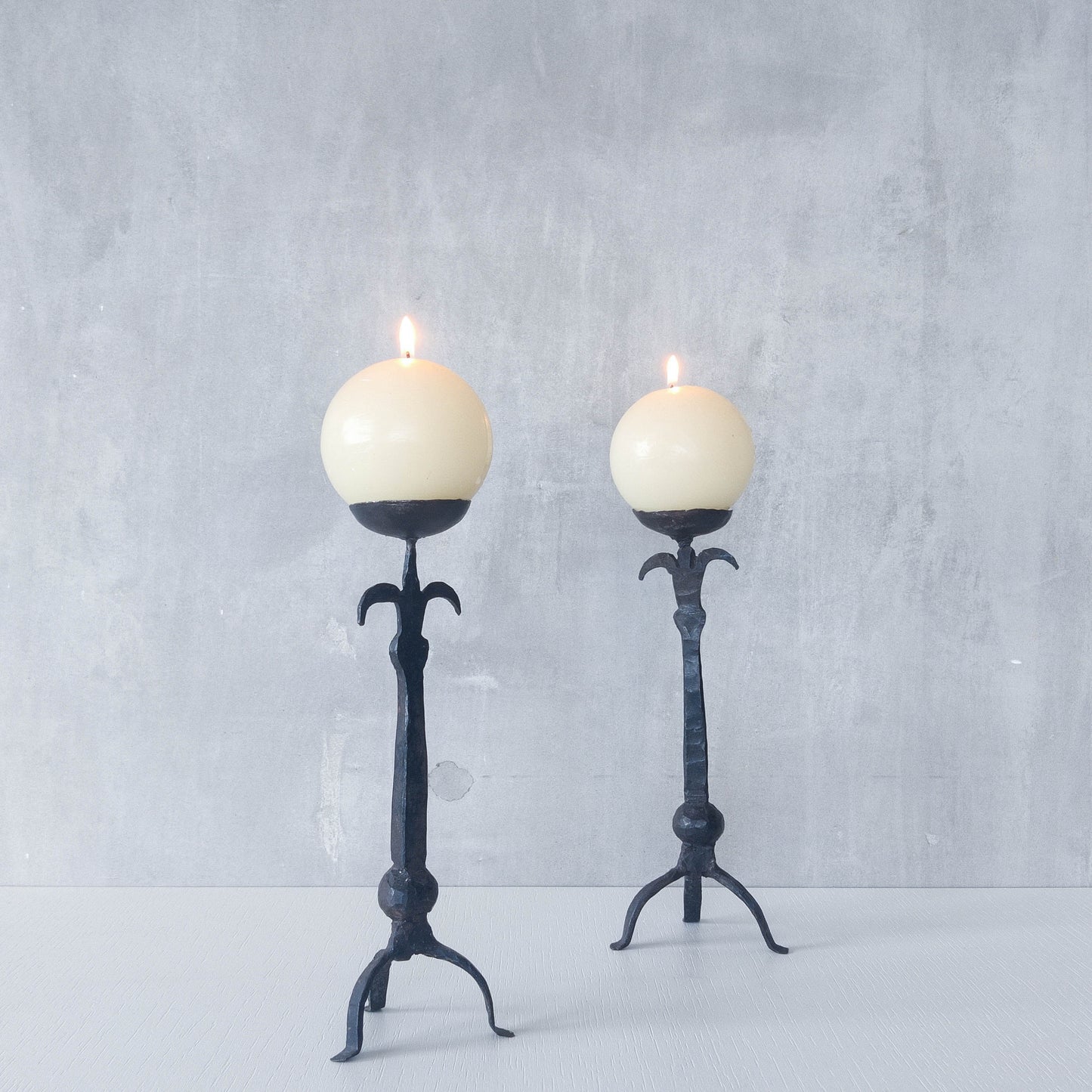 Pair of vintage hand forged wrought iron blacksmith made candle holders crude style