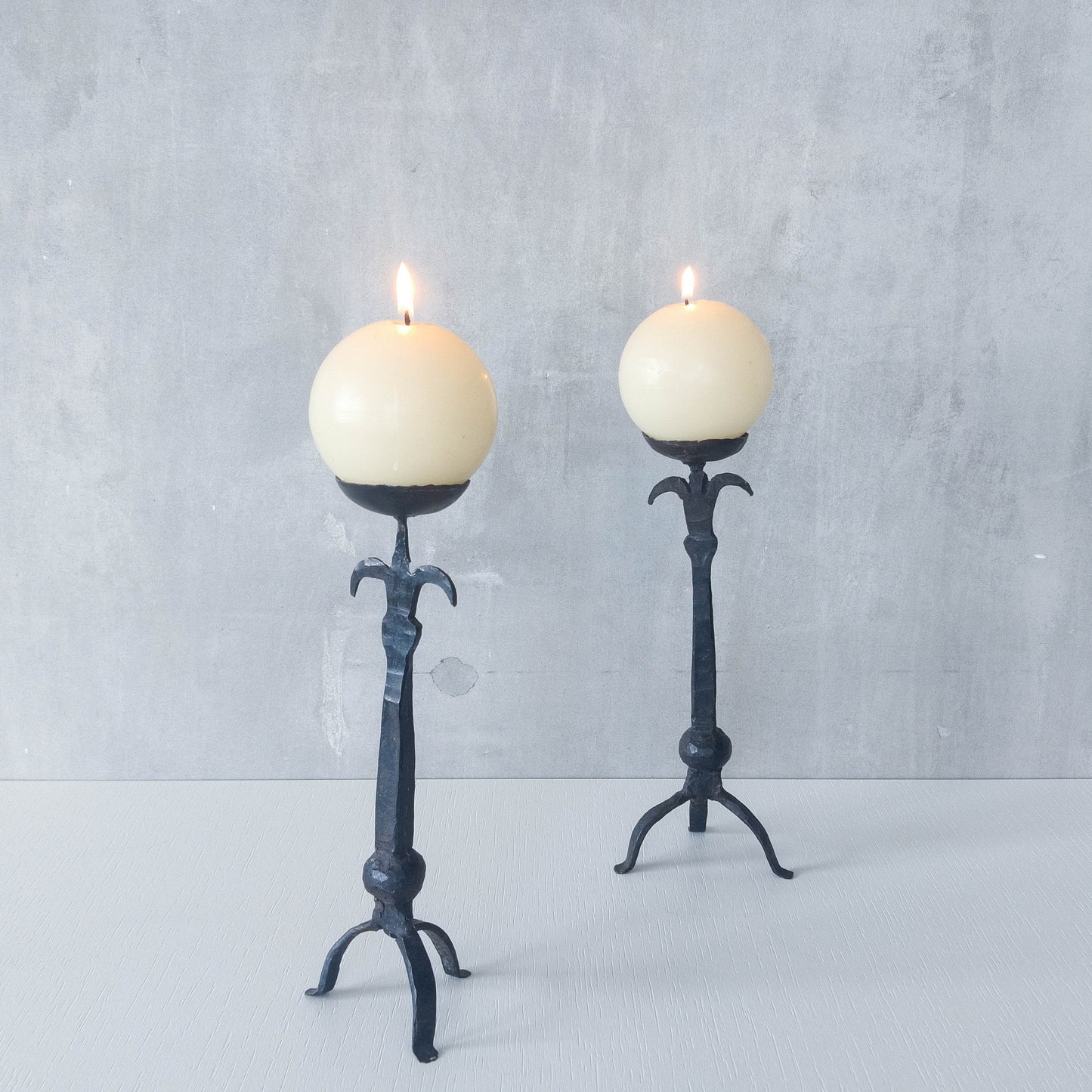 Pair of vintage hand forged wrought iron blacksmith made candle holders crude style