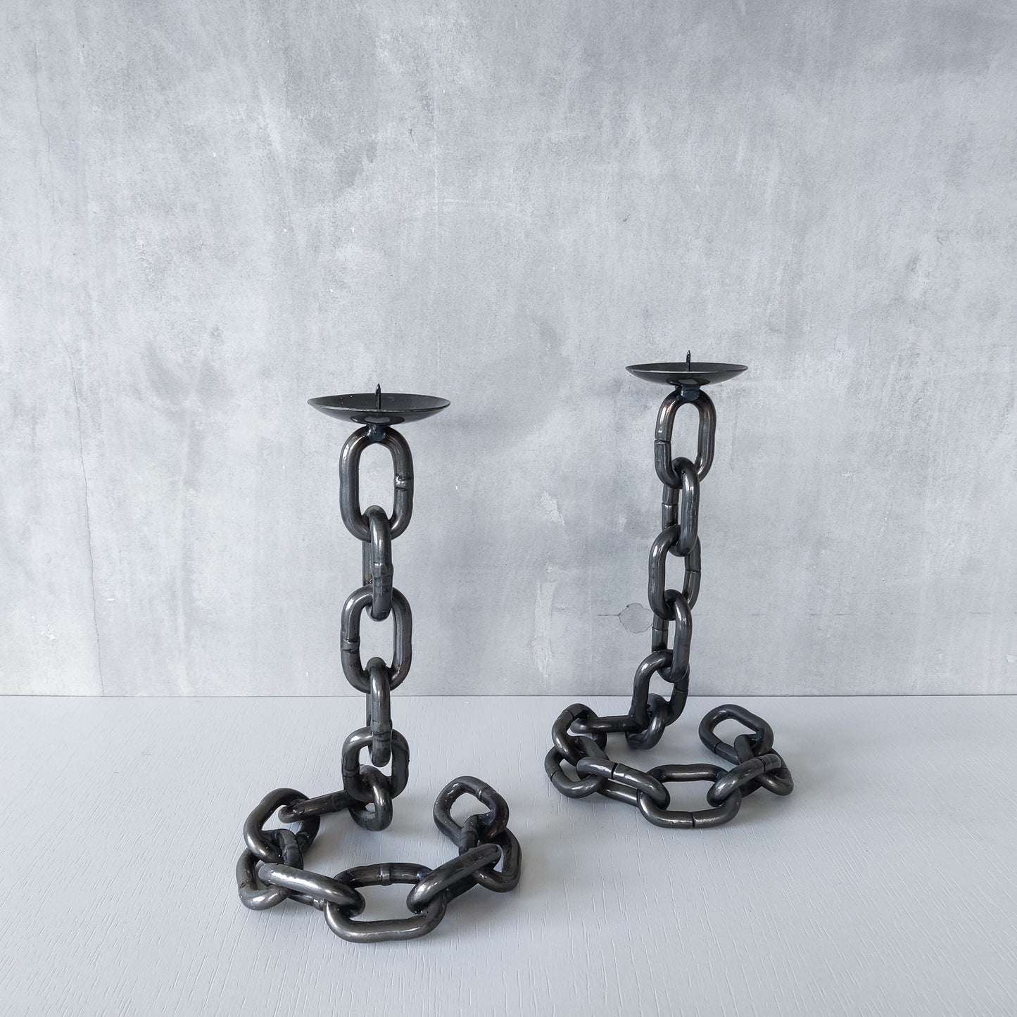 Pair of brutalist heavy hand welded steel chain link sculptural candle holders