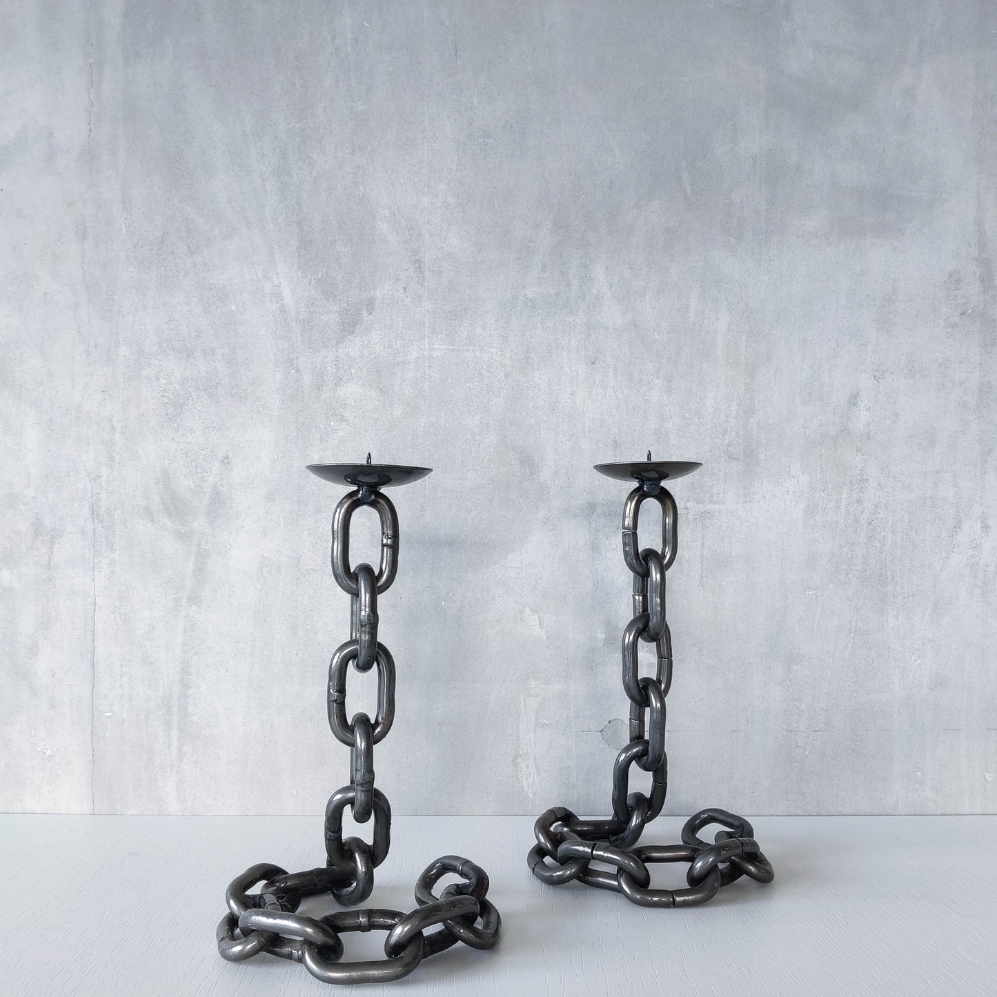 Pair of brutalist heavy hand welded steel chain link sculptural candle holders
