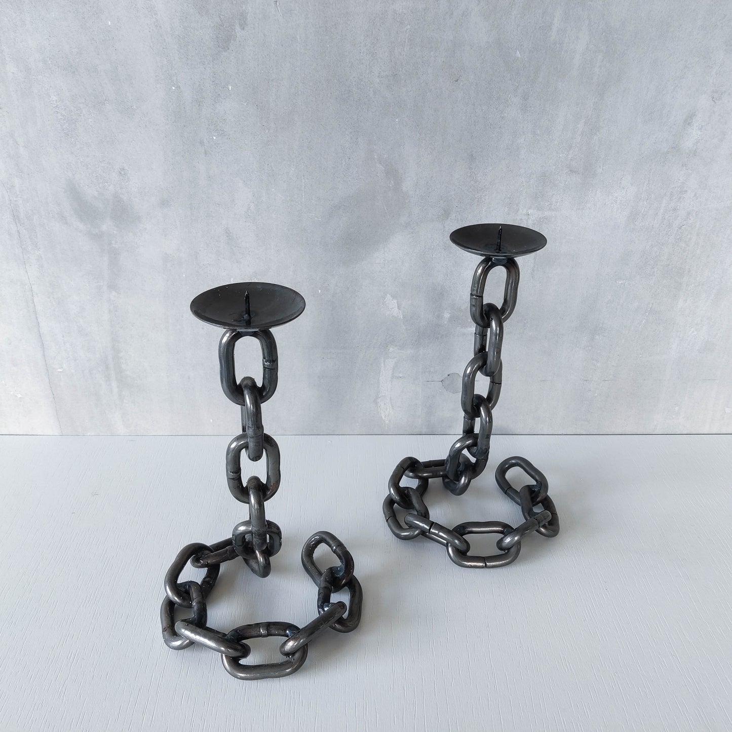 Pair of brutalist heavy hand welded steel chain link sculptural candle holders