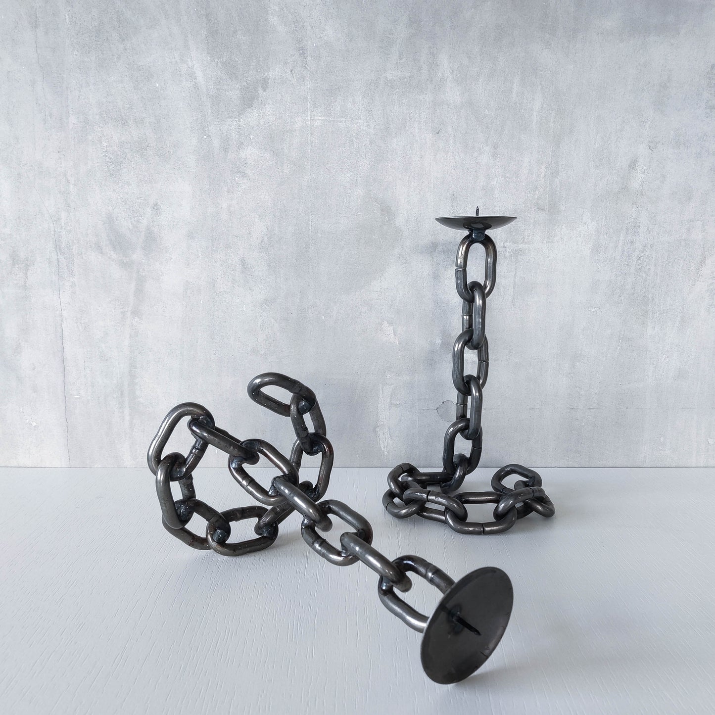 Pair of brutalist heavy hand welded steel chain link sculptural candle holders