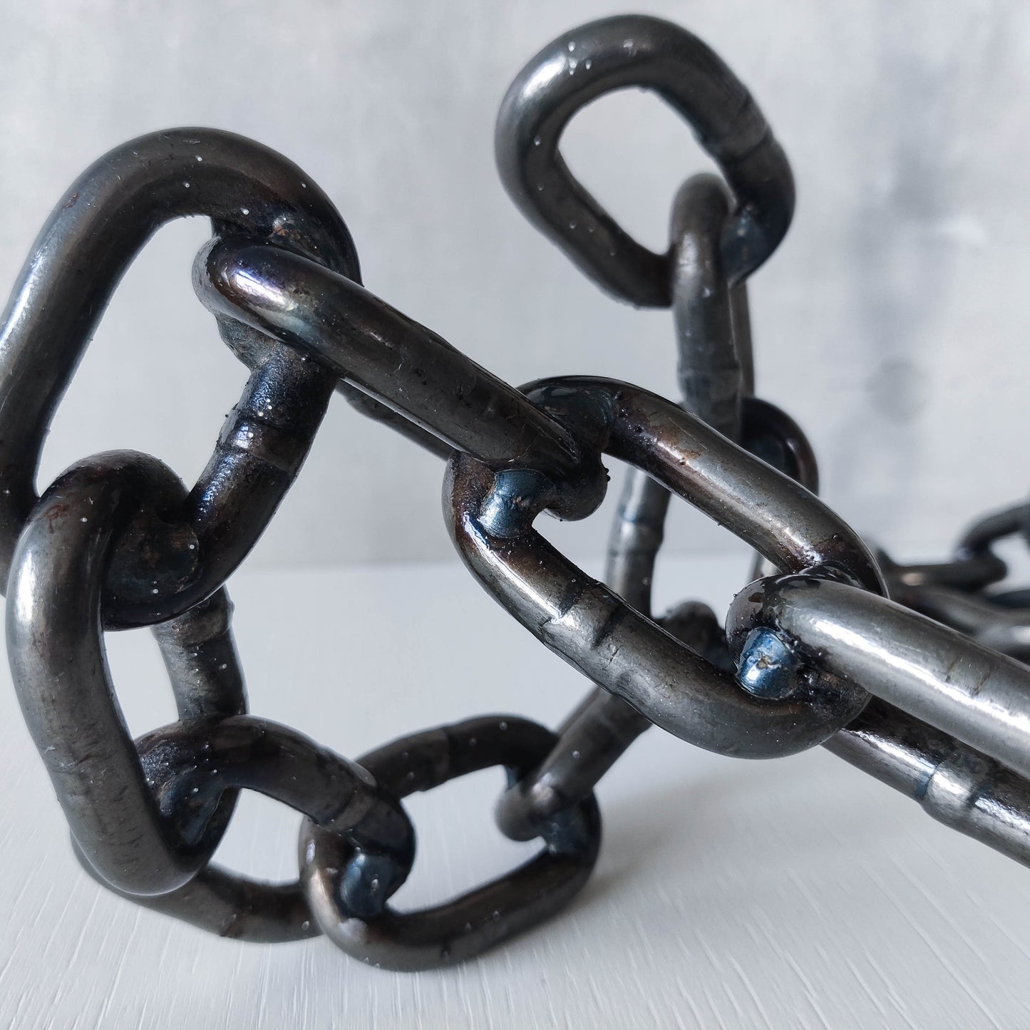 Pair of brutalist heavy hand welded steel chain link sculptural candle holders