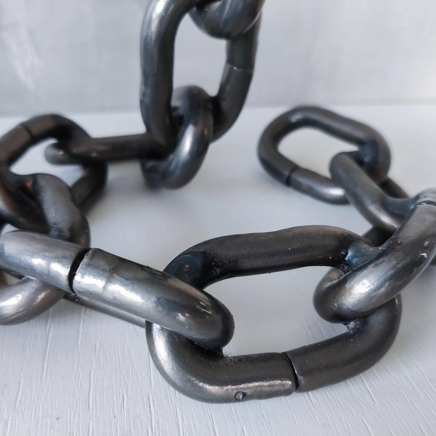 Pair of brutalist heavy hand welded steel chain link sculptural candle holders