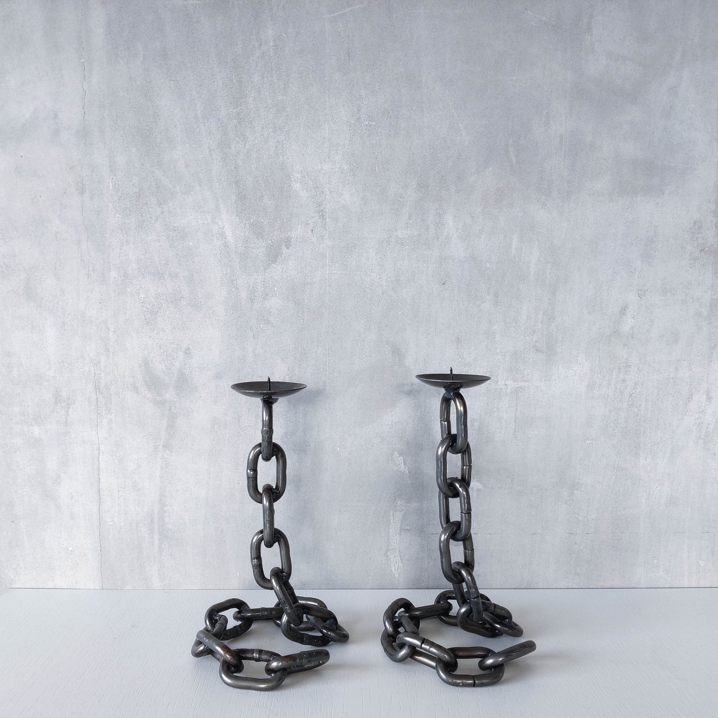 Pair of brutalist heavy hand welded steel chain link sculptural candle holders