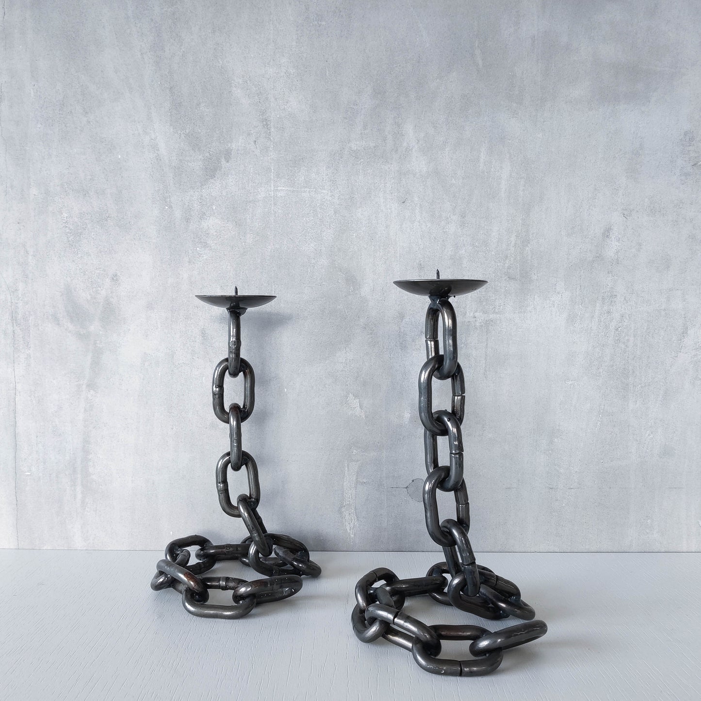 Pair of brutalist heavy hand welded steel chain link sculptural candle holders
