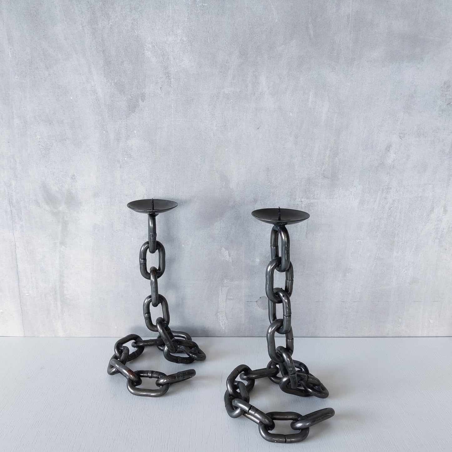 Pair of brutalist heavy hand welded steel chain link sculptural candle holders