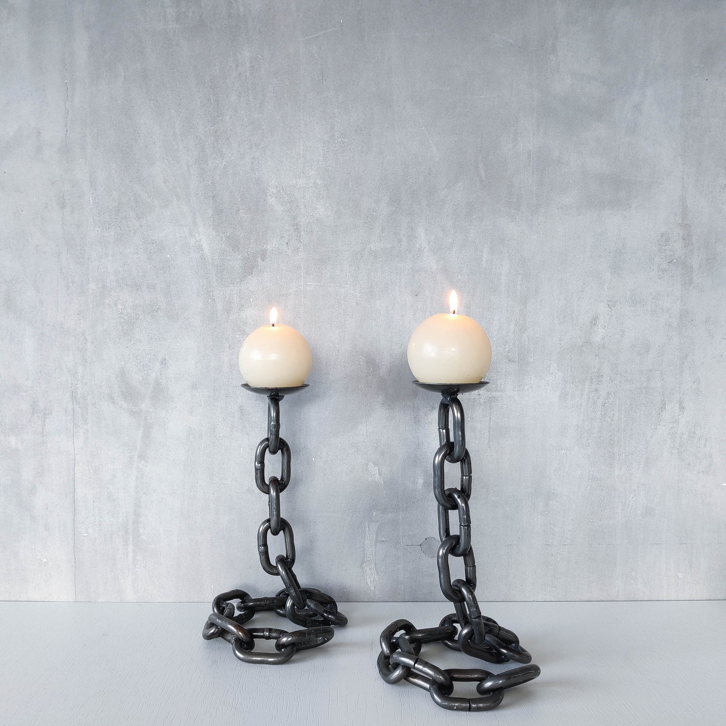 Pair of brutalist heavy hand welded steel chain link sculptural candle holders