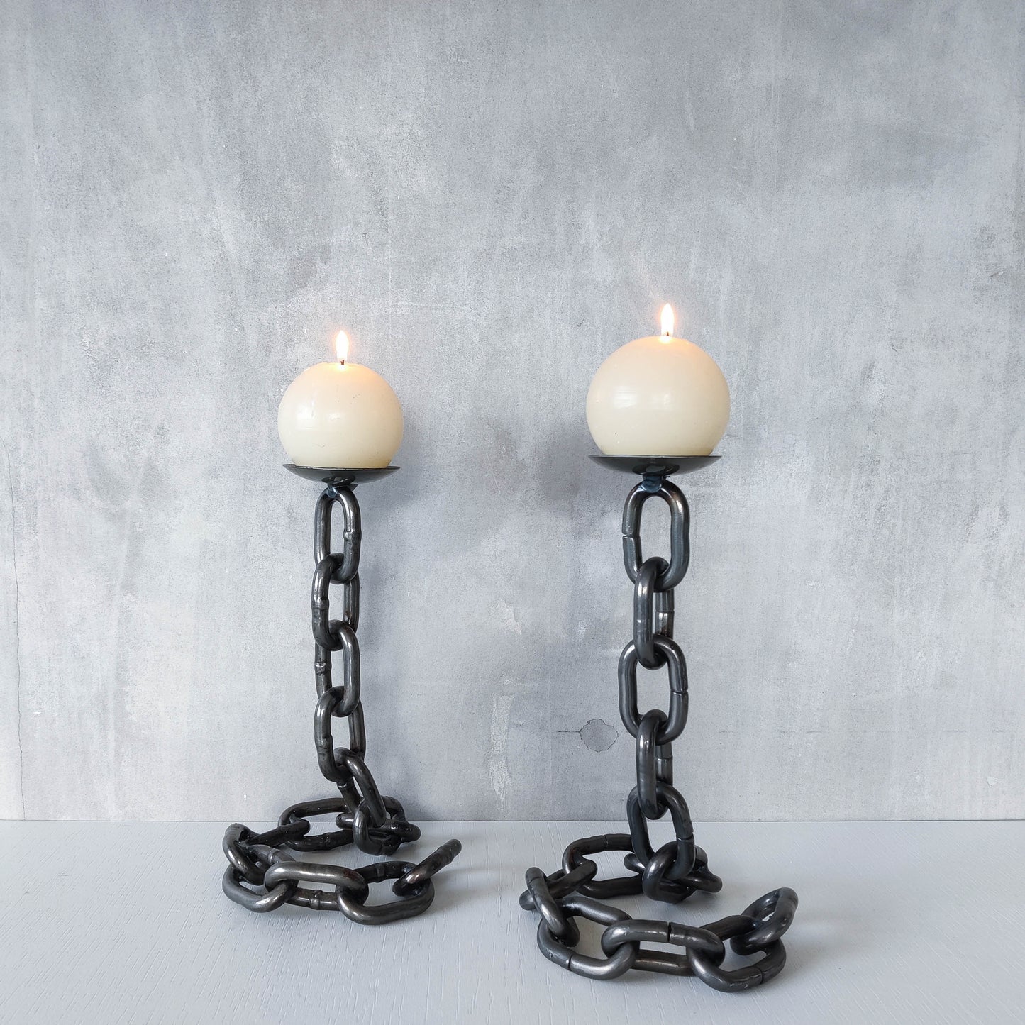 Pair of brutalist heavy hand welded steel chain link sculptural candle holders