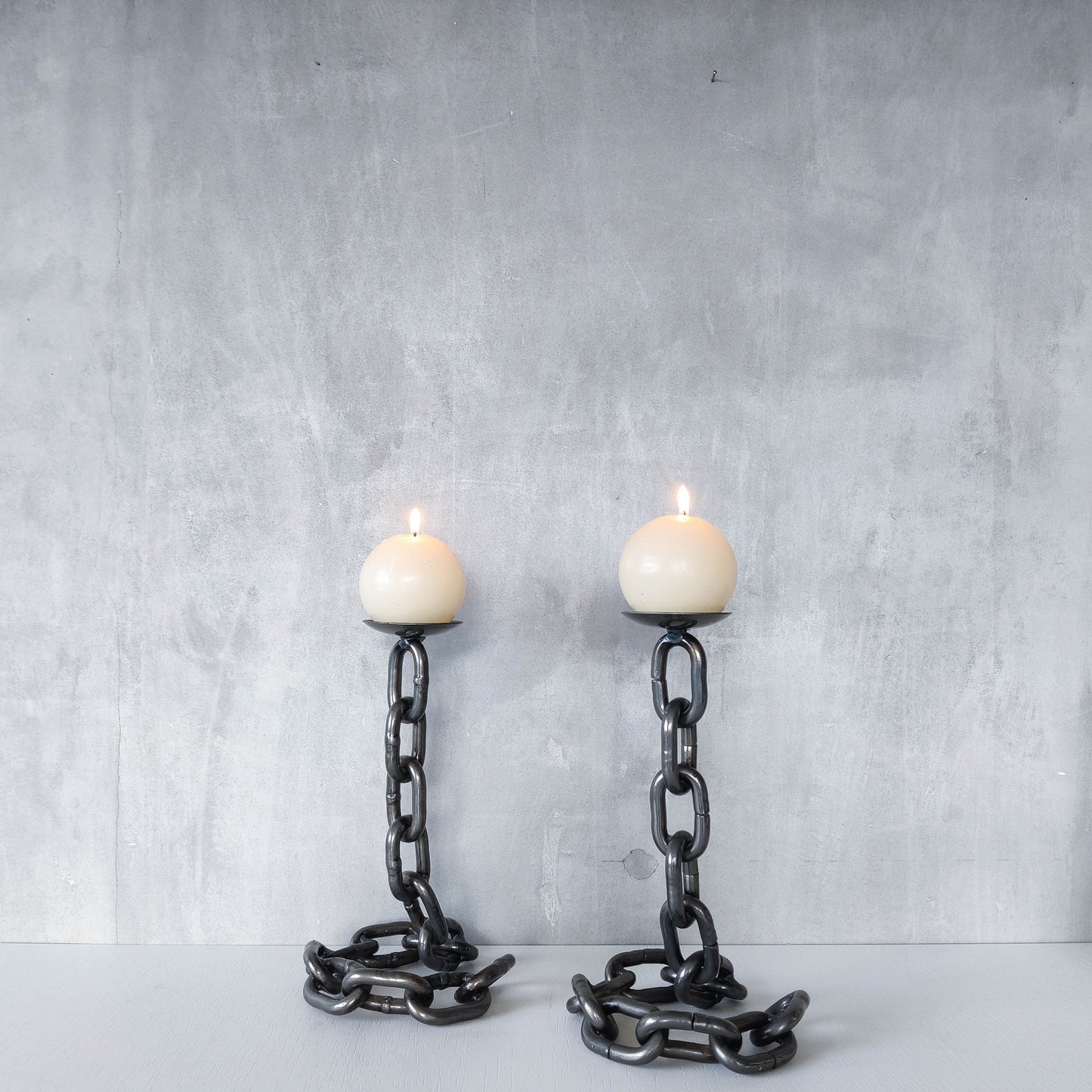 Pair of brutalist heavy hand welded steel chain link sculptural candle holders