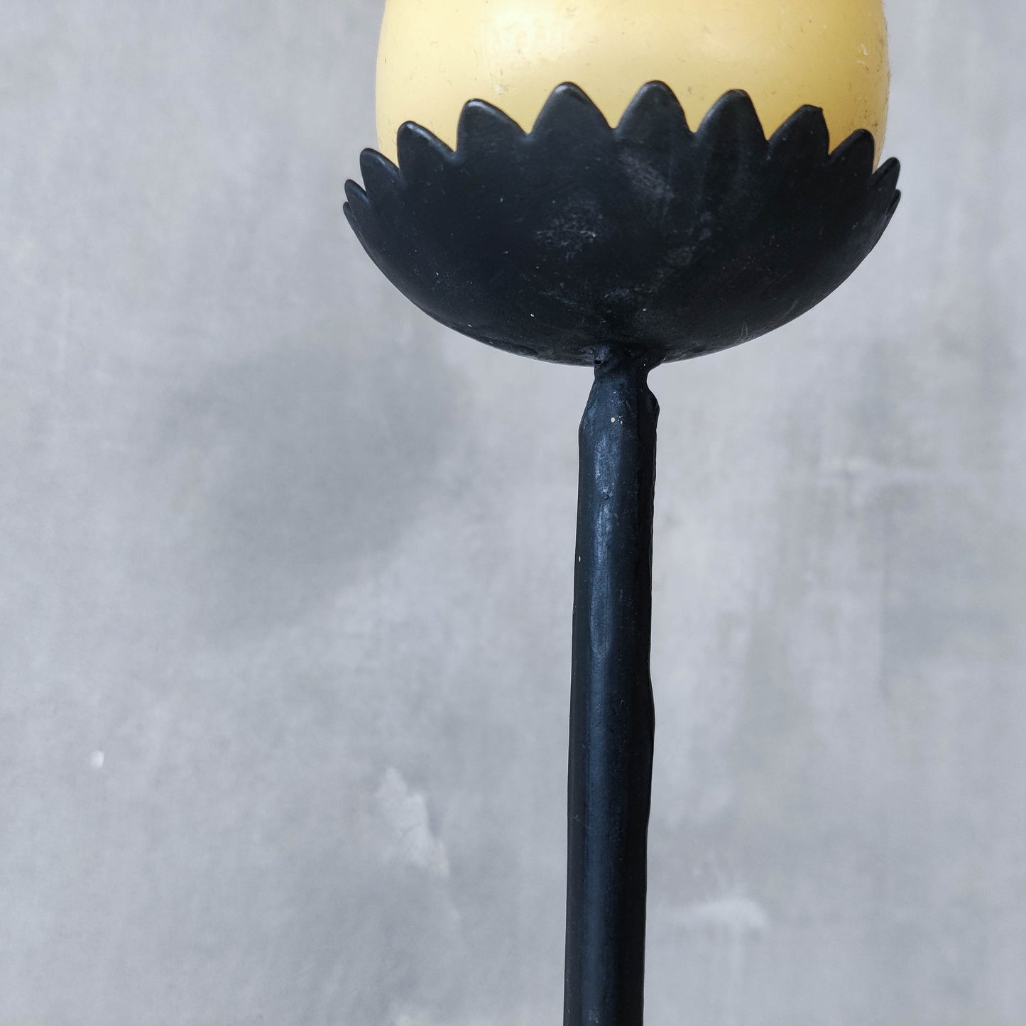 Hand forged black iron sculptural candle holder with scalloped edge tripod feet