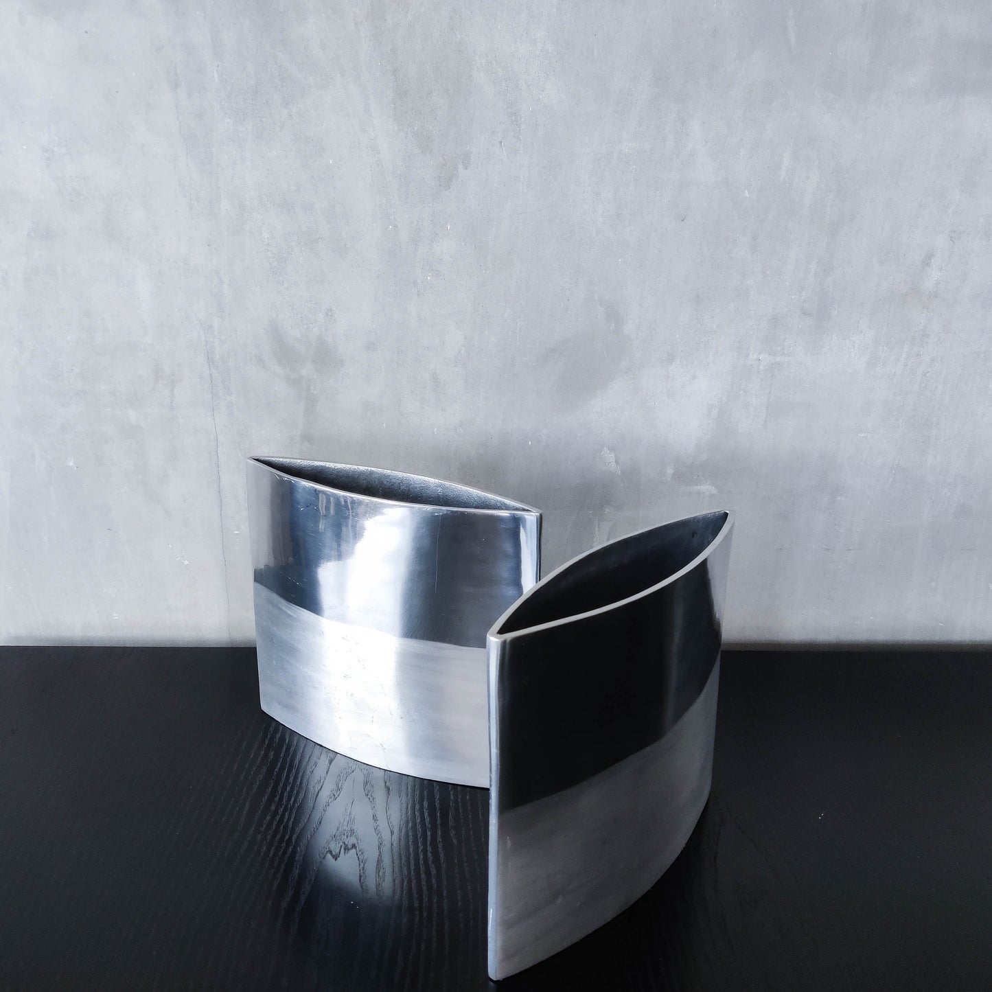 Pair of vintage 00s flat sculptural hand cast aluminium vases