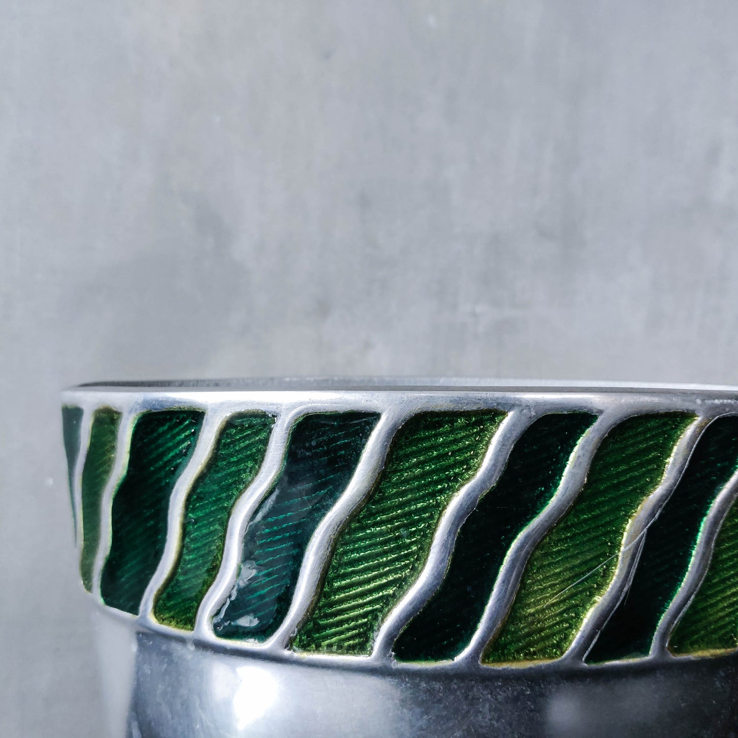 Pair of vintage 00s cast aluminium sculptural vases with green enamel wave inlay