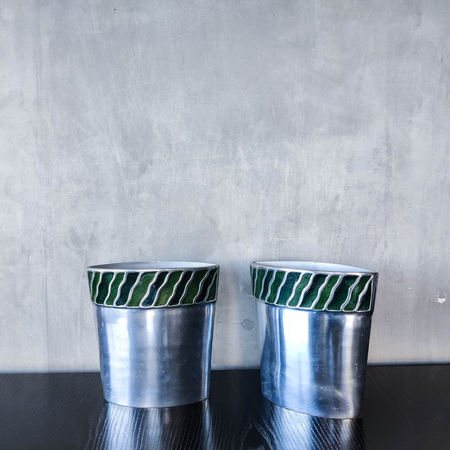Pair of vintage 00s cast aluminium sculptural vases with green enamel wave inlay