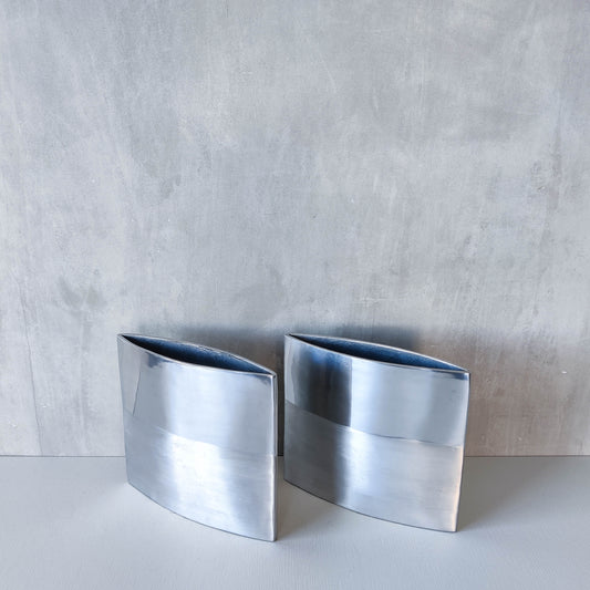 Pair of vintage 00s flat sculptural hand cast aluminium vases