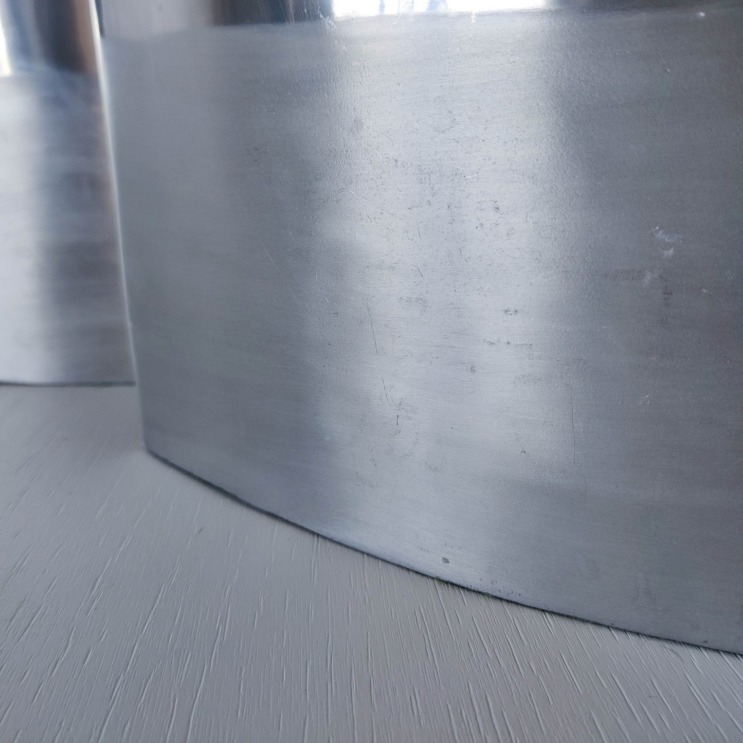 Pair of vintage 00s flat sculptural hand cast aluminium vases