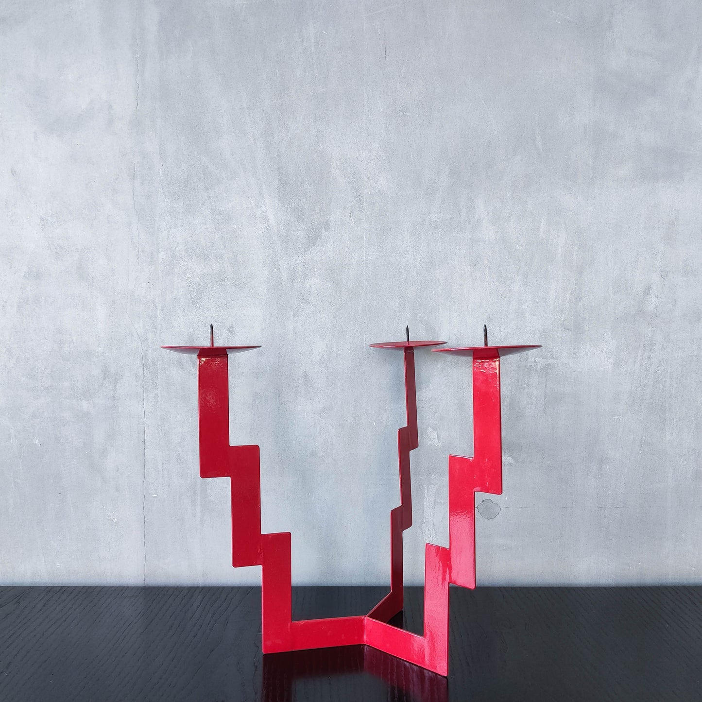 Vintage postmodern style large red steel zigzag candelabra