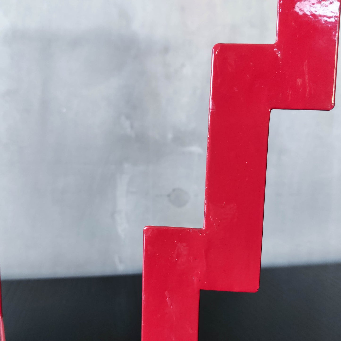 Vintage postmodern style large red steel zigzag candelabra