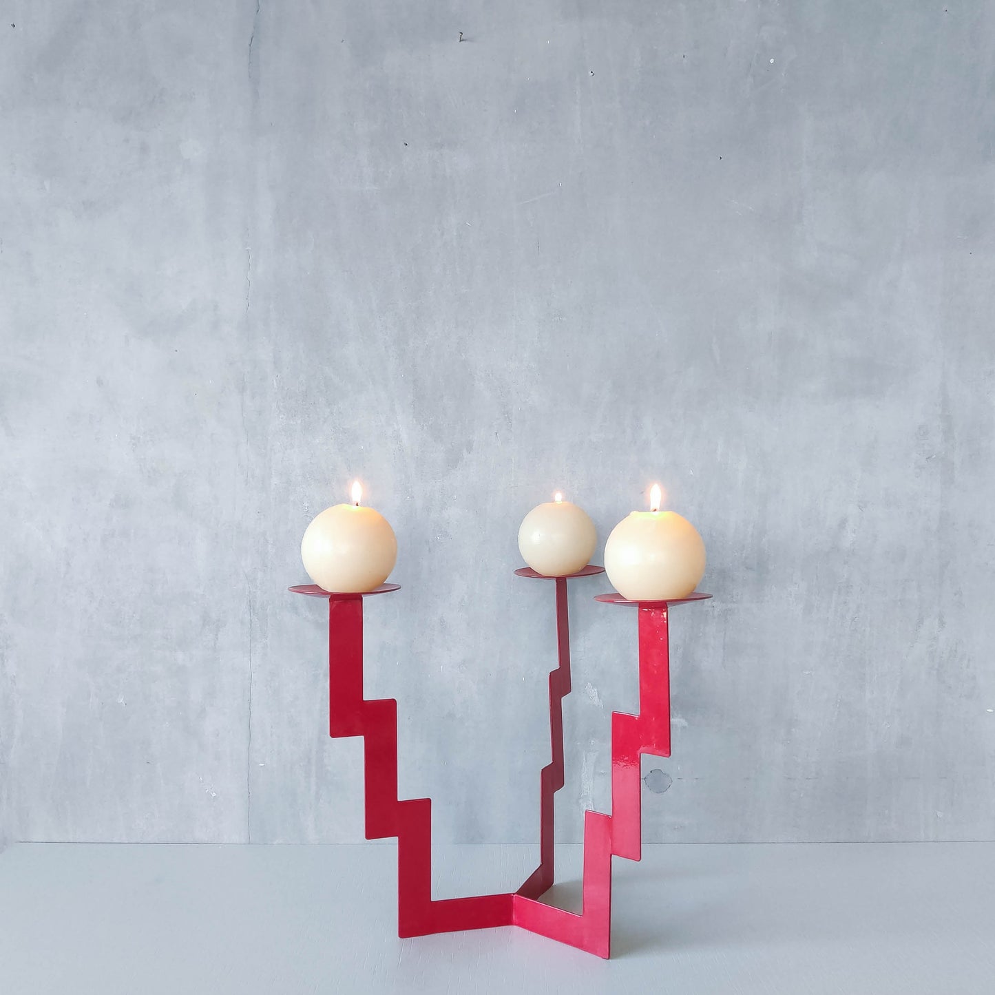 Vintage postmodern style large red steel zigzag candelabra