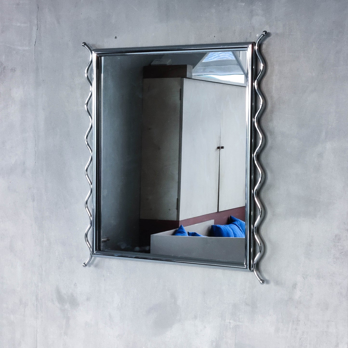 Vintage 1990s postmodern style chrome silver metal mirror with wavy edges