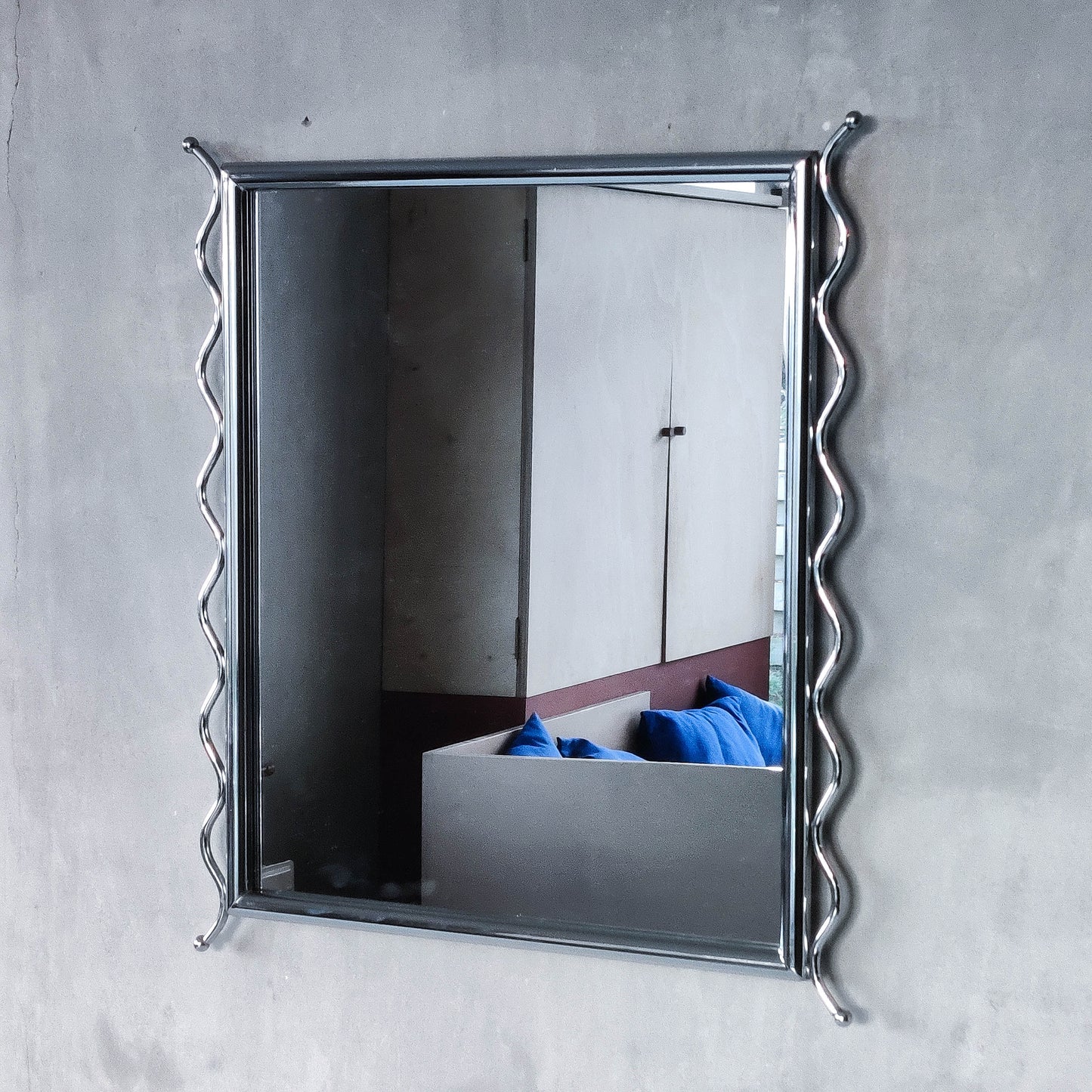Vintage 1990s postmodern style chrome silver metal mirror with wavy edges