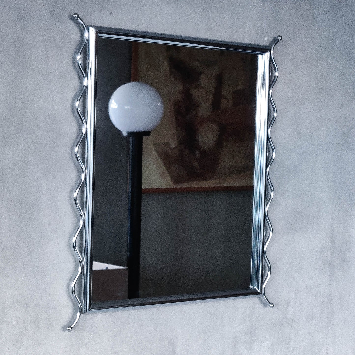 Vintage 1990s postmodern style chrome silver metal mirror with wavy edges