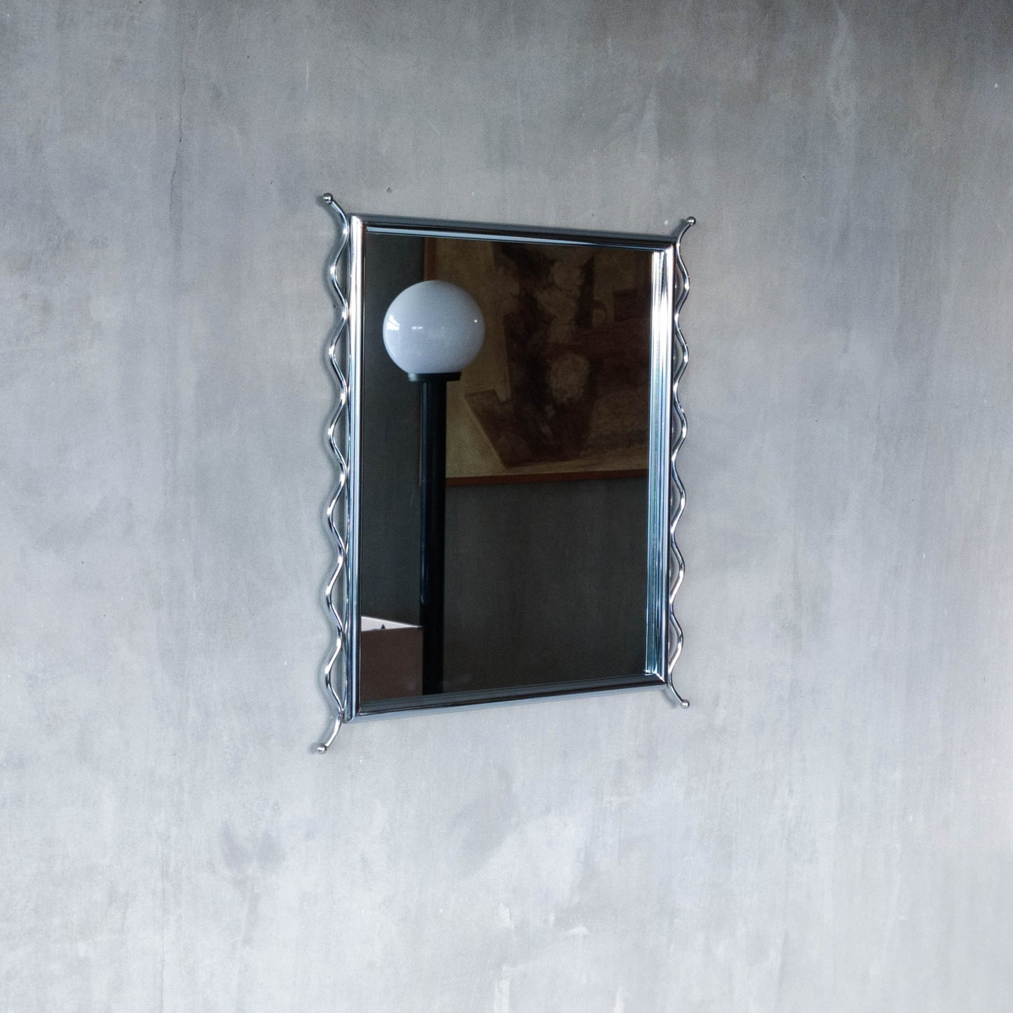 Vintage 1990s postmodern style chrome silver metal mirror with wavy edges