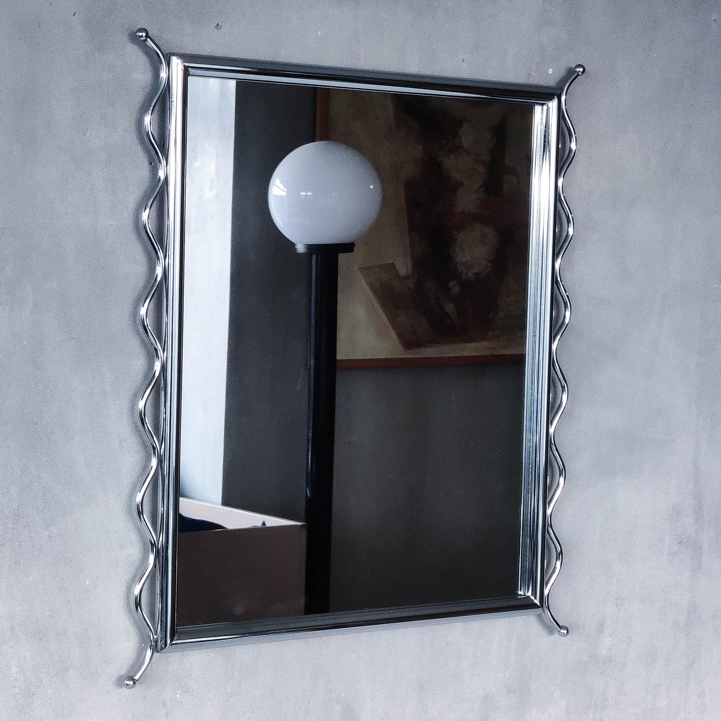 Vintage 1990s postmodern style chrome silver metal mirror with wavy edges