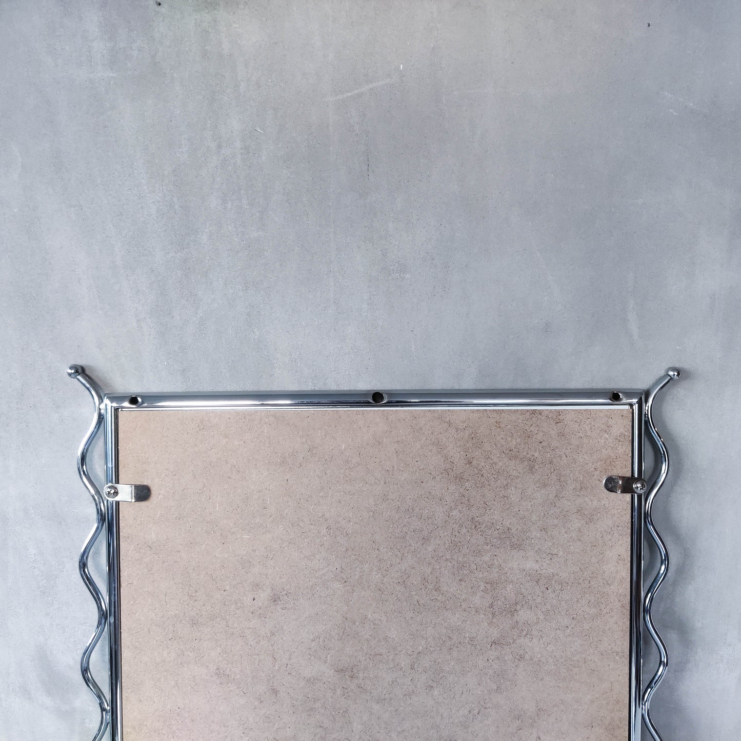 Vintage 1990s postmodern style chrome silver metal mirror with wavy edges