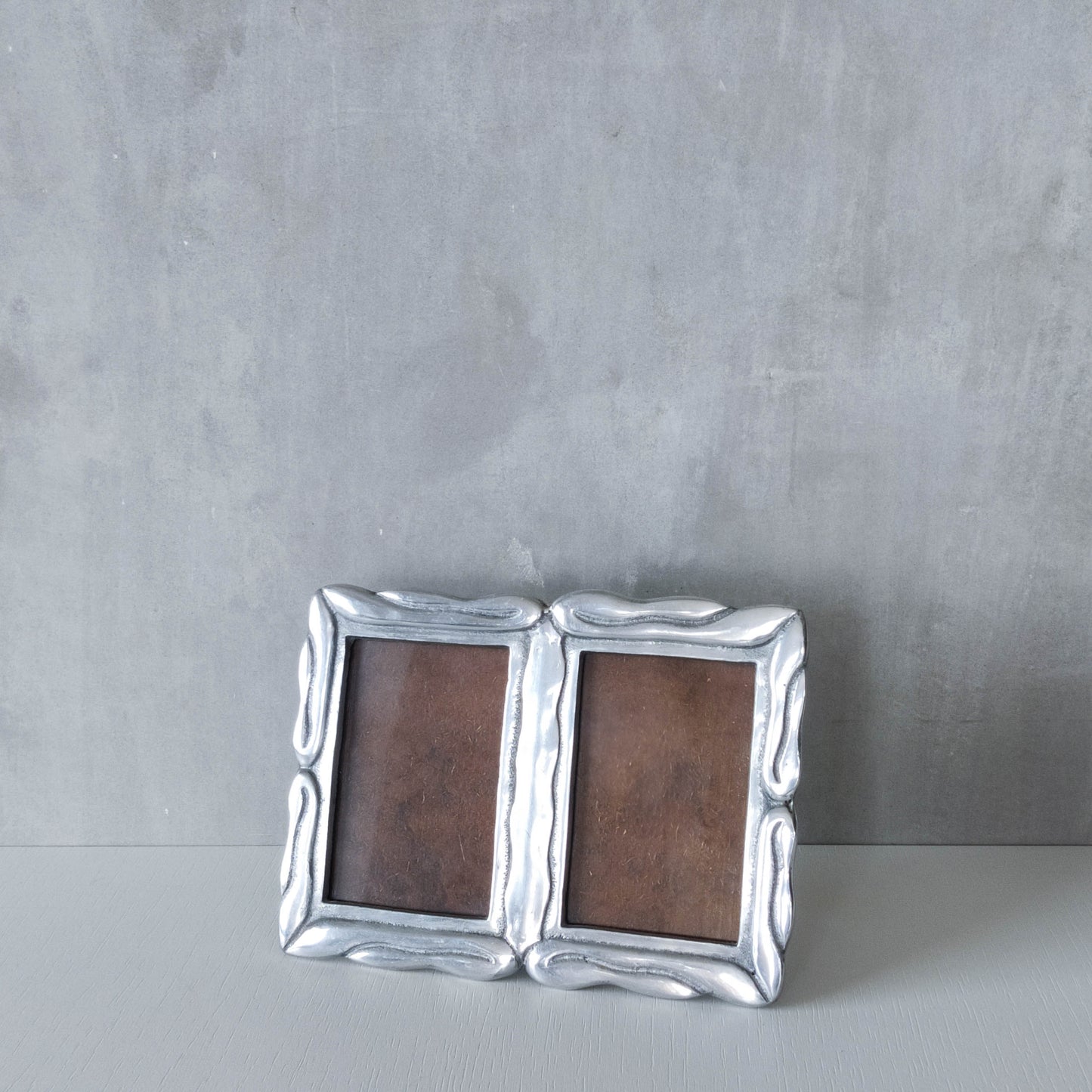 Vintage 1990s cast aluminium organic modernist form double picture photo frame