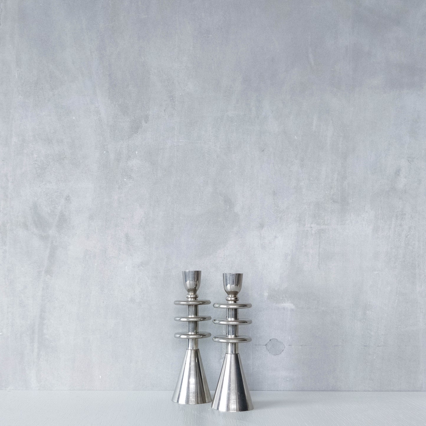 Vintage pair of chrome modernist form sculptural tiered candle holders
