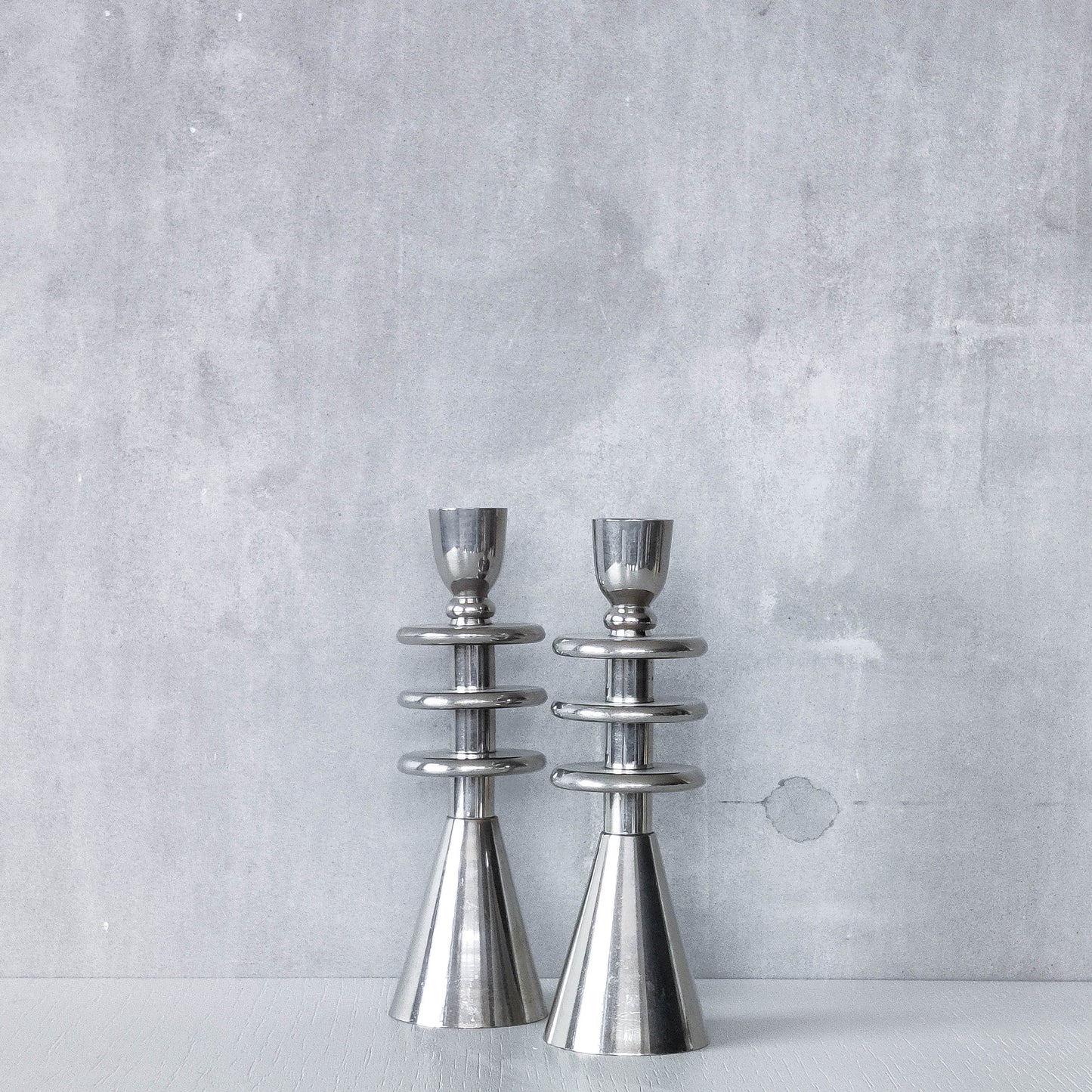Vintage pair of chrome modernist form sculptural tiered candle holders