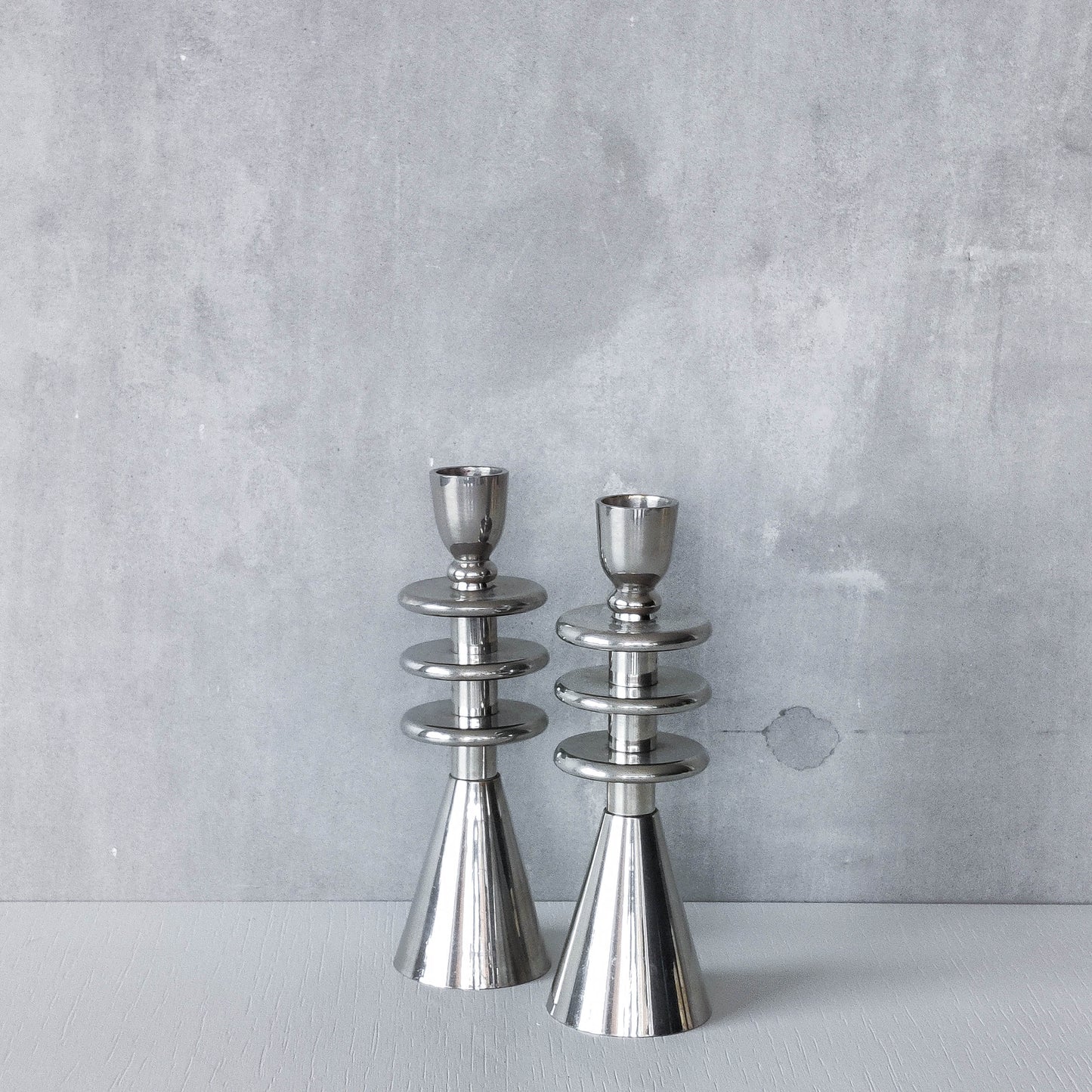 Vintage pair of chrome modernist form sculptural tiered candle holders